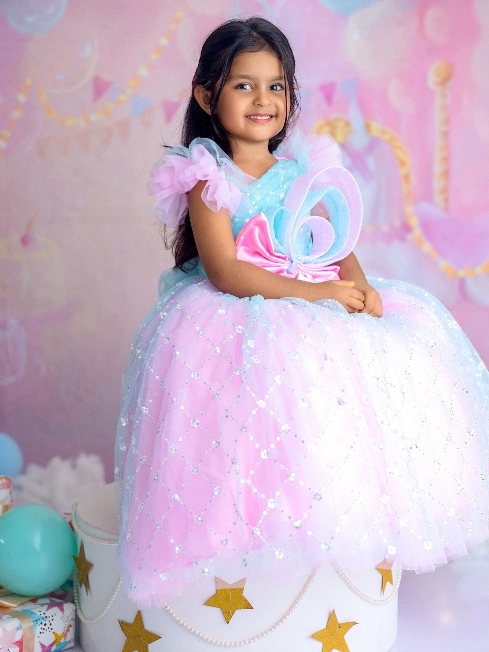 Blue and pink sequence ball gown with bow detailing