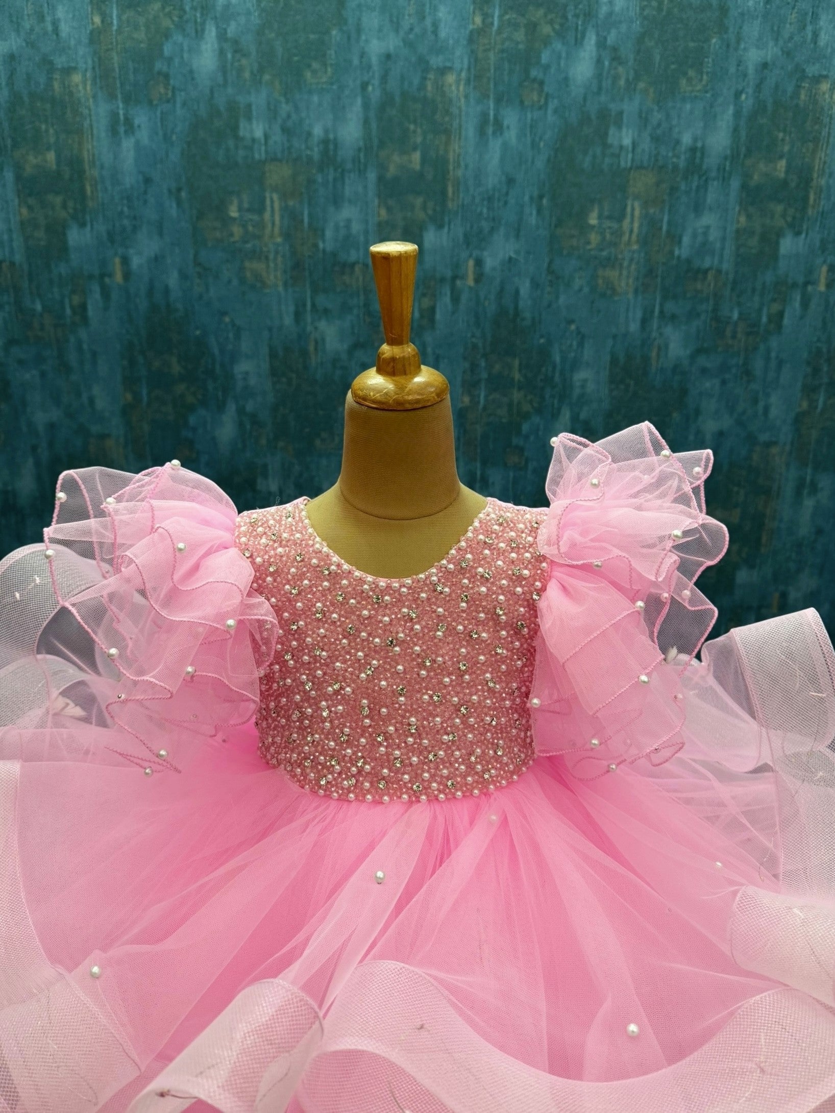 Twinkle Rose pink ruffle gown with intricate work