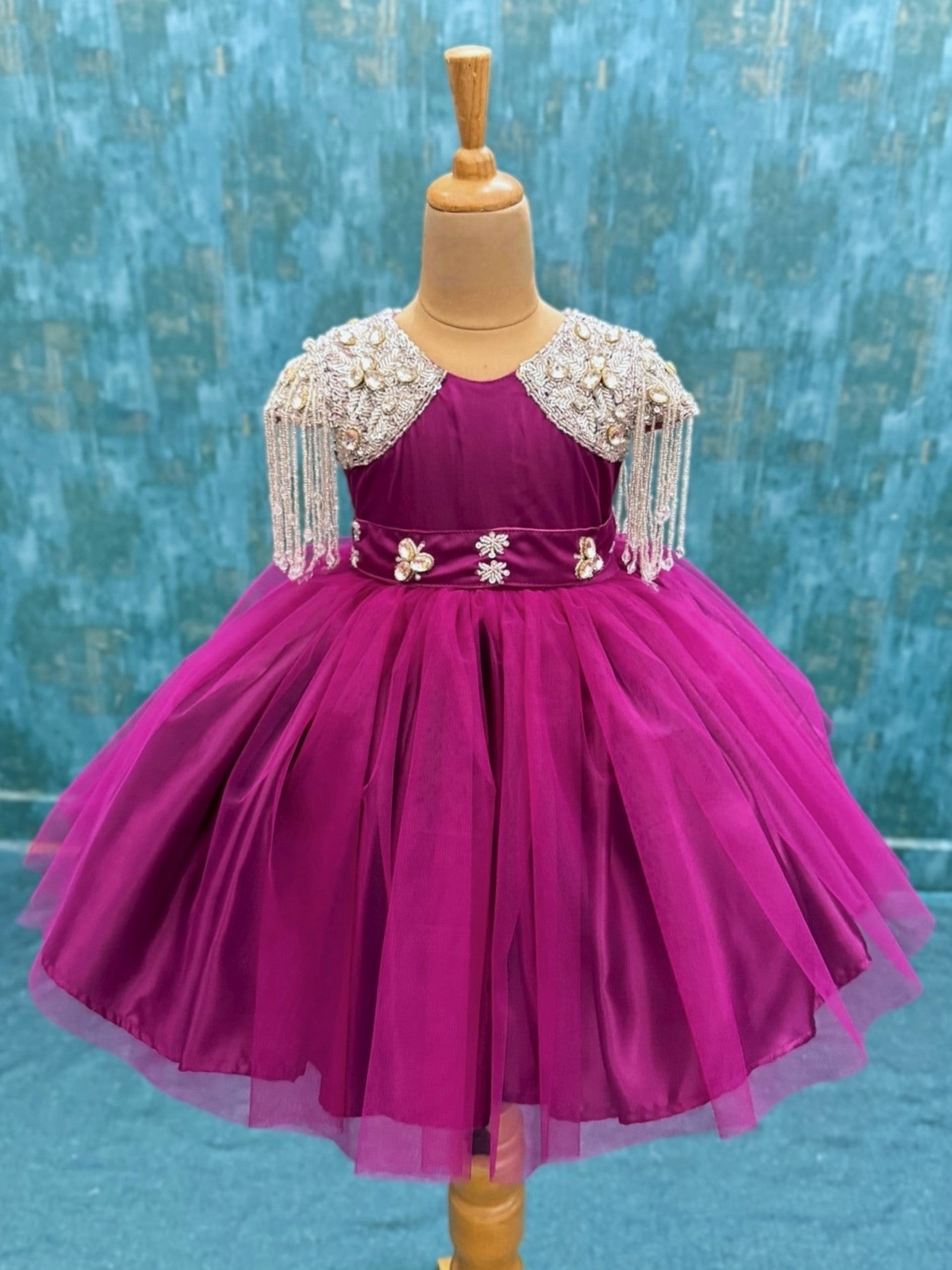 dreamy magenta gown with crystal hanging sleeves and waist belt