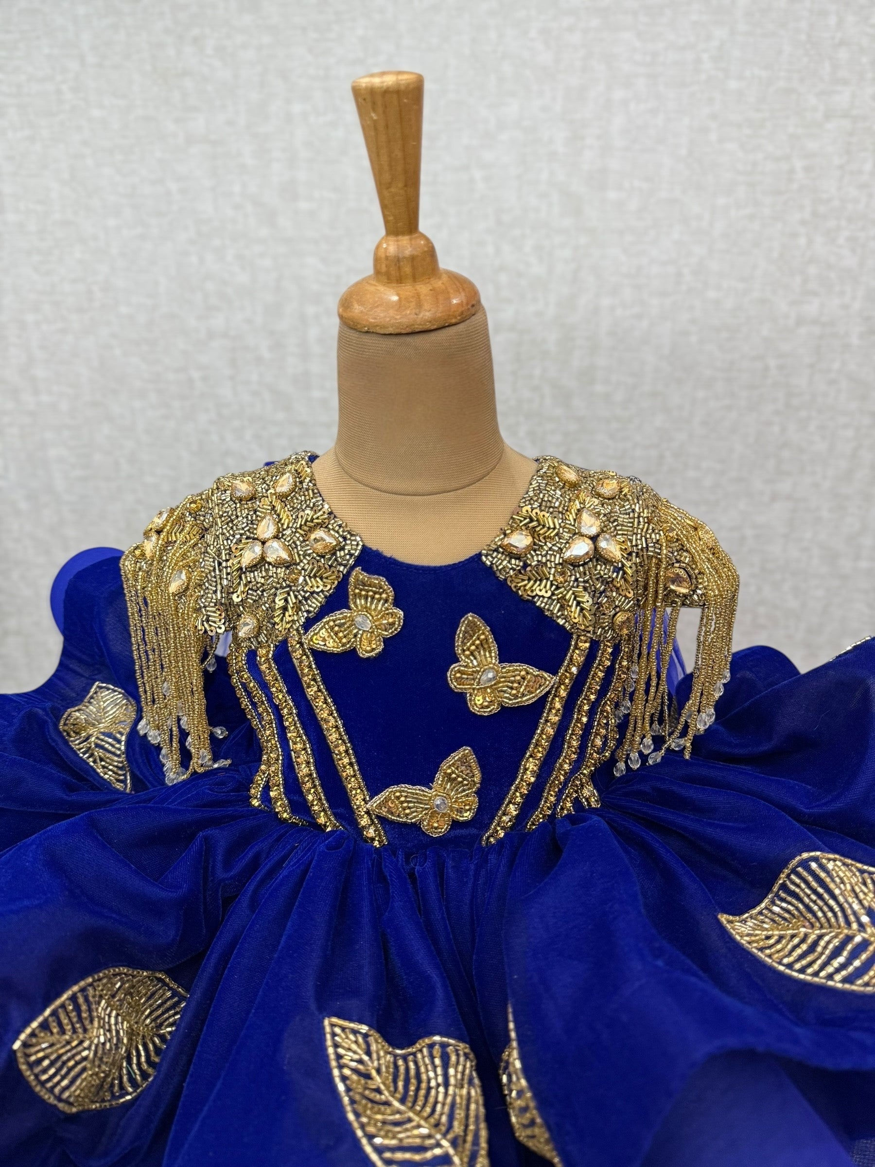 royal blue butterfly gown with gold intricate hand work