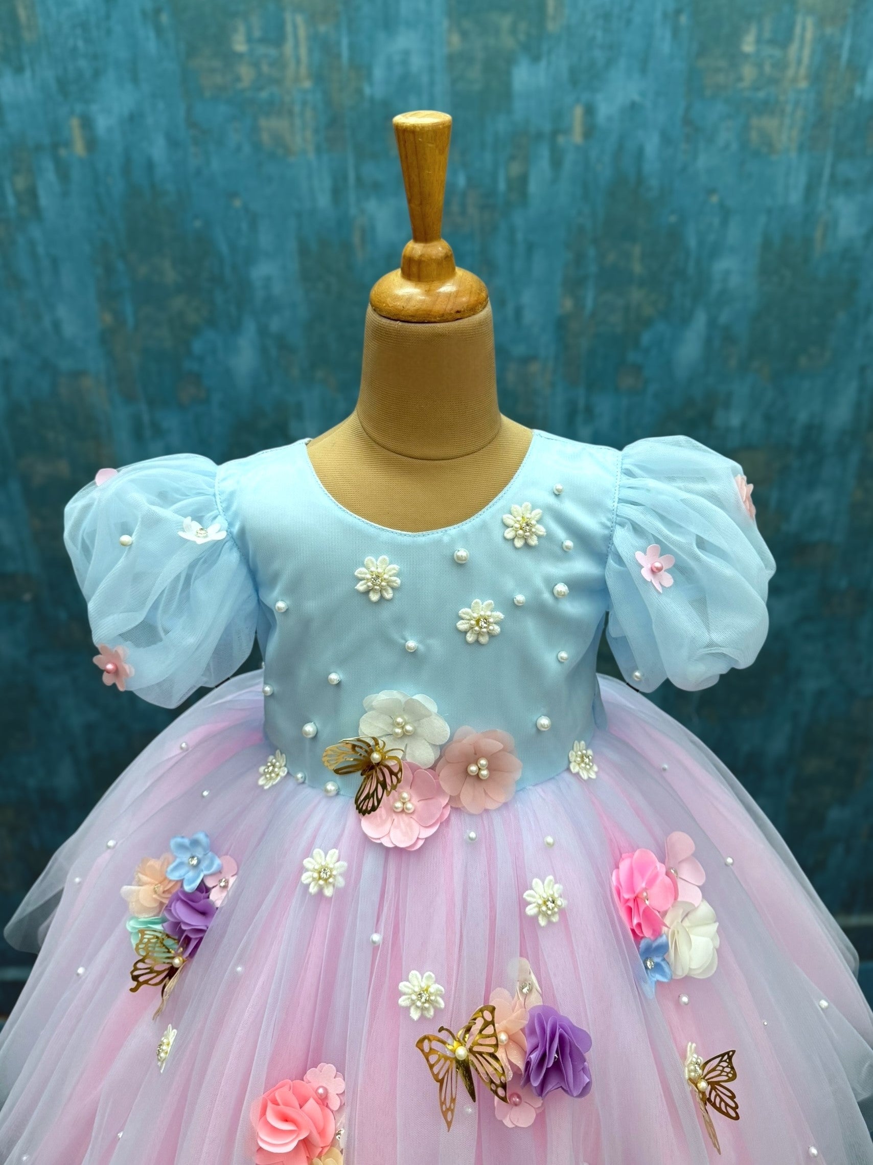 pink and blue floral gown with puff sleeves