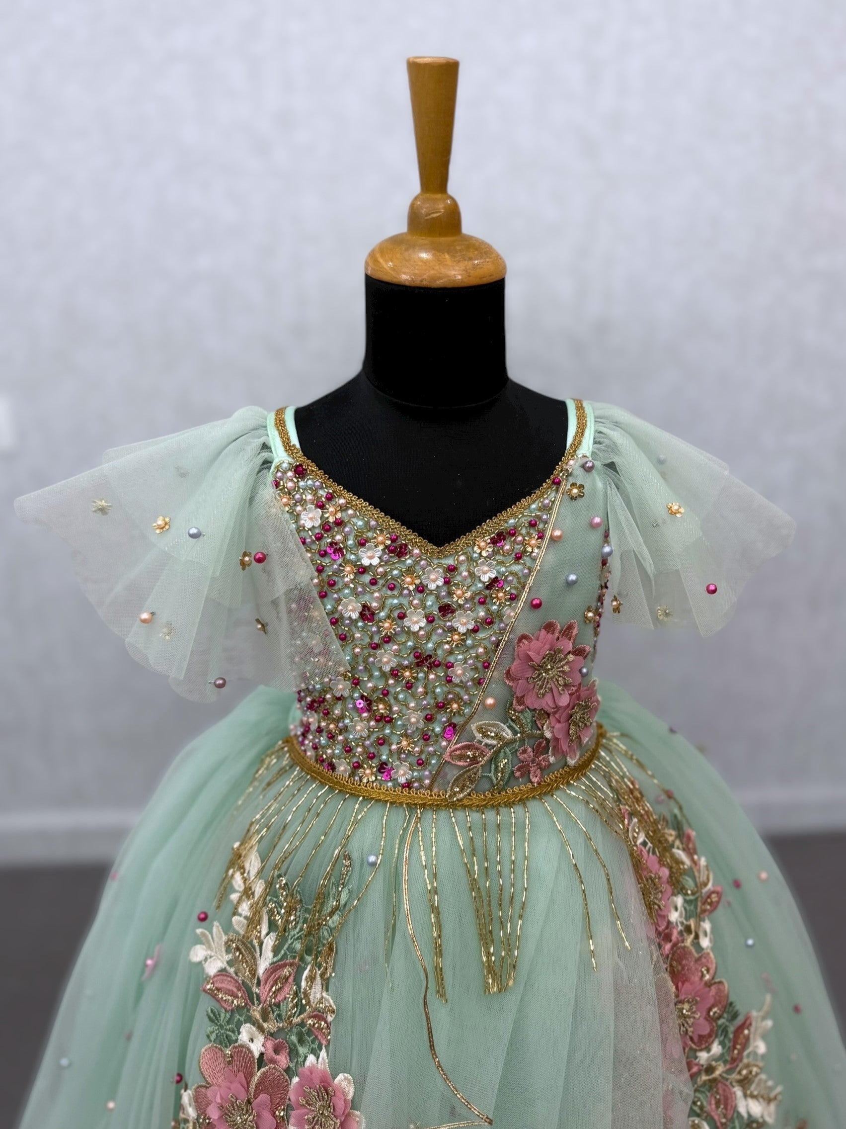 mint floral and hanging draped ball gown with intricate hand work