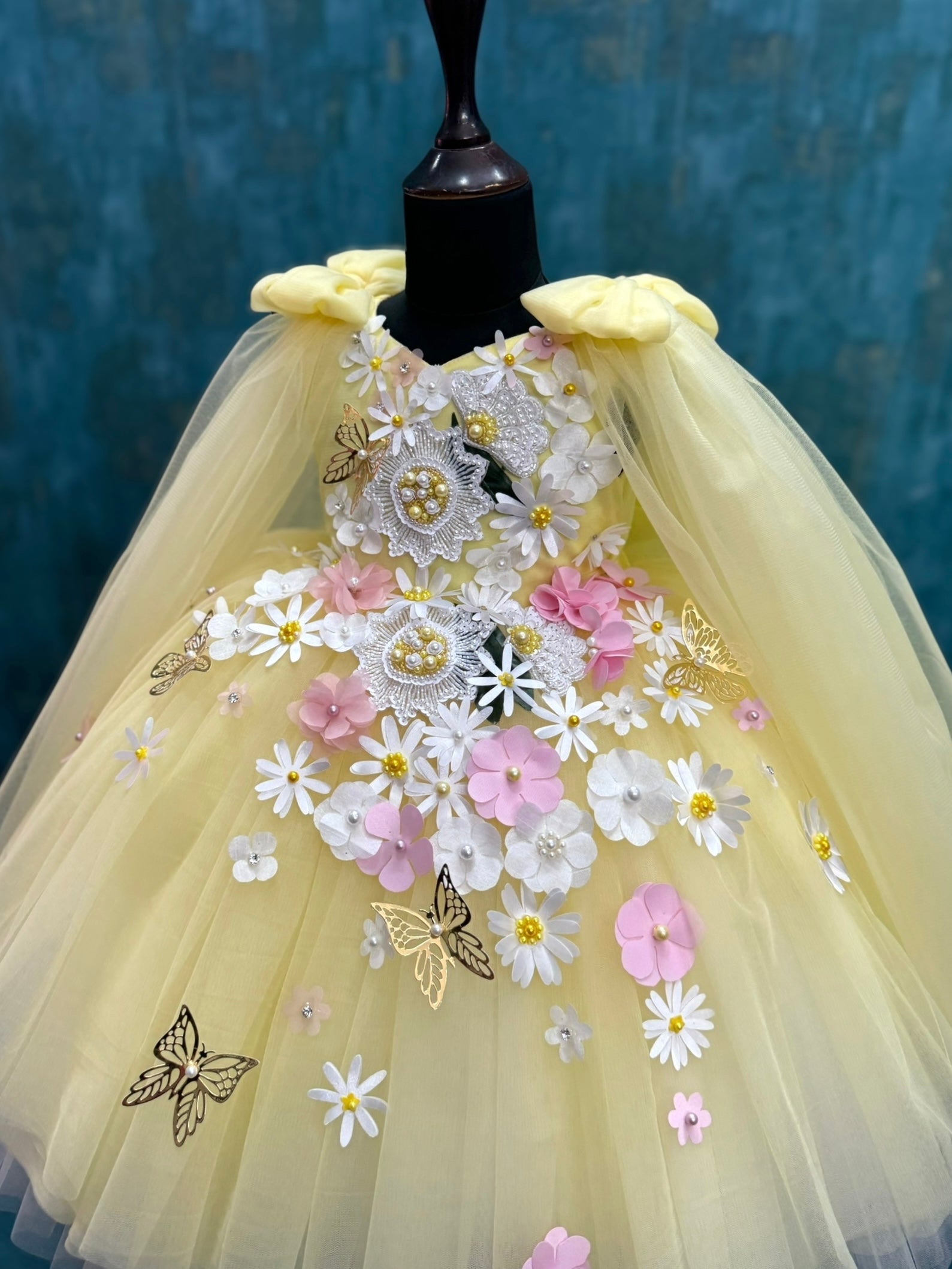 yellow and white floral and butterfly ball gown with intricate work