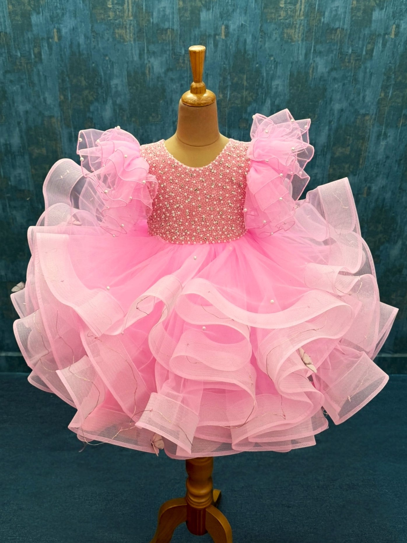 Twinkle Rose pink ruffle gown with intricate work