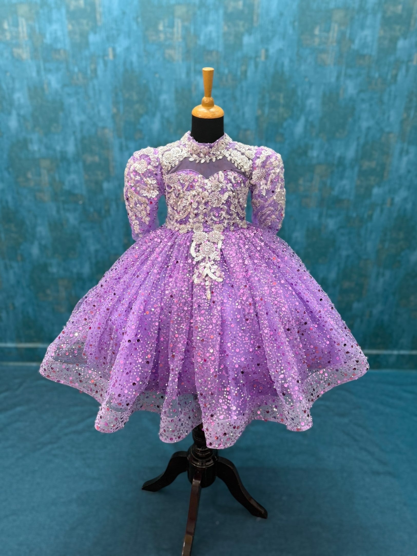 lavender sequence ball gown with high neck and puff sleeves with silver intricate work