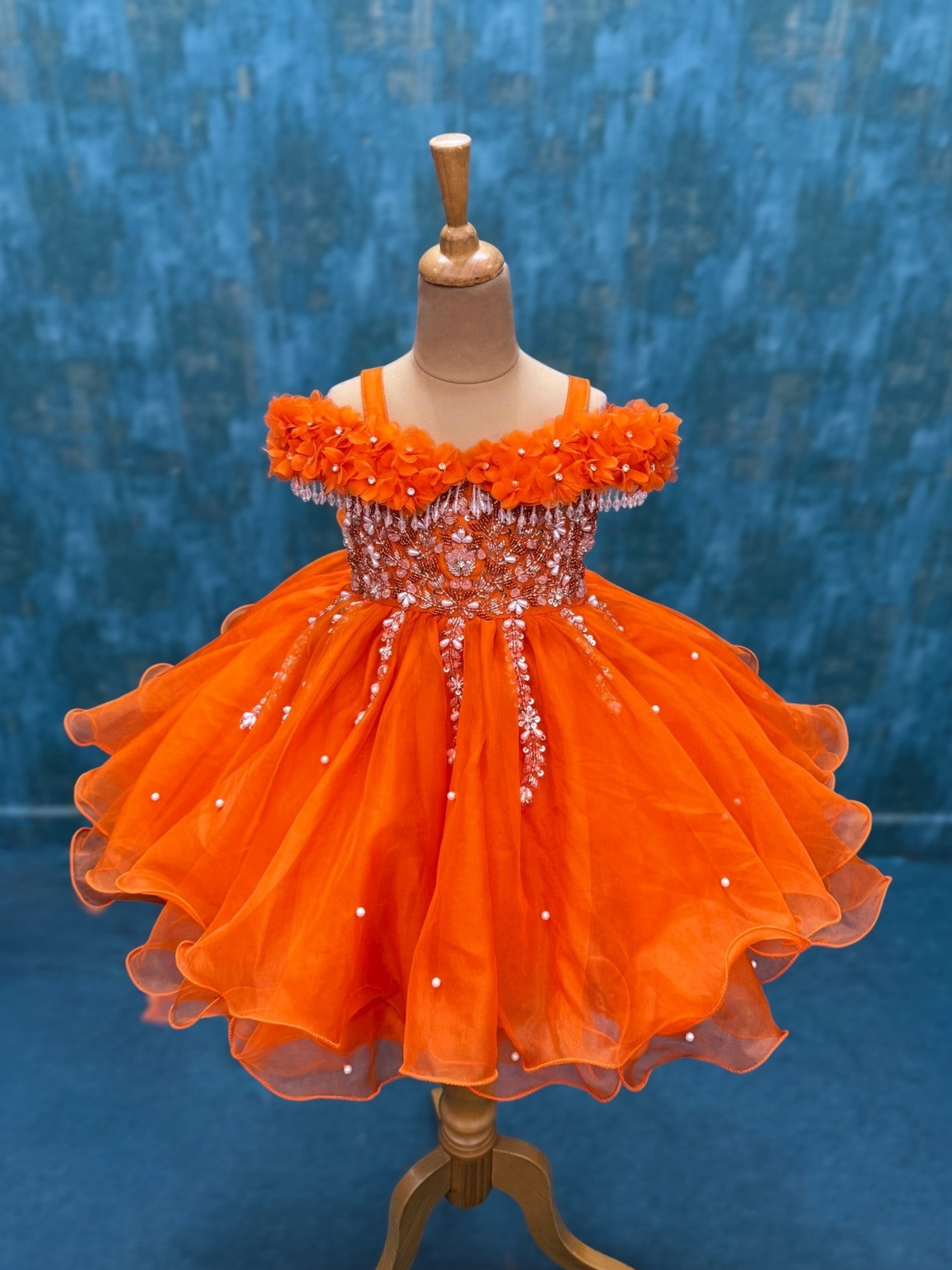 orange organza layer gown with intricate hand work