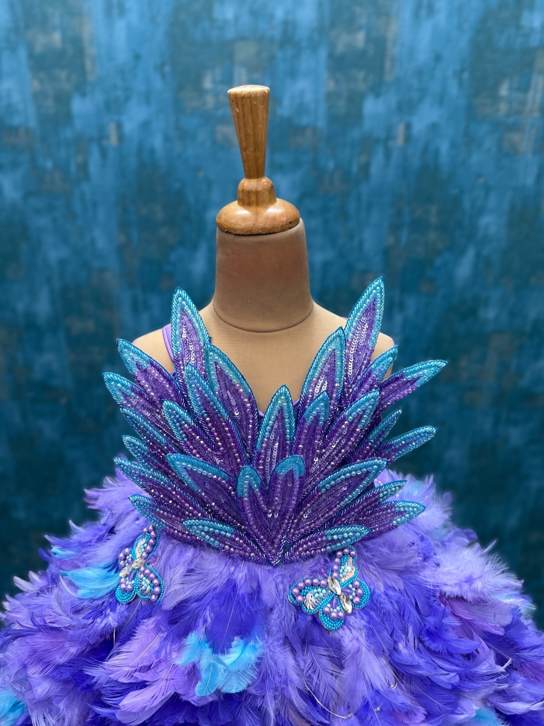 purple ombre feather panel gown with heavy petal embroidery top