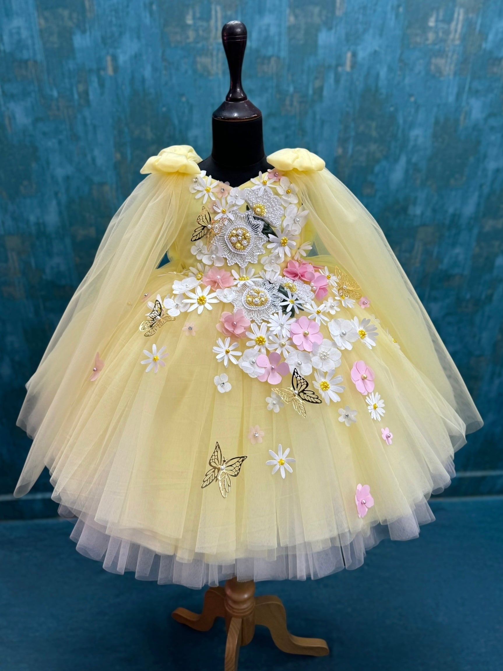 yellow and white floral and butterfly ball gown with intricate work