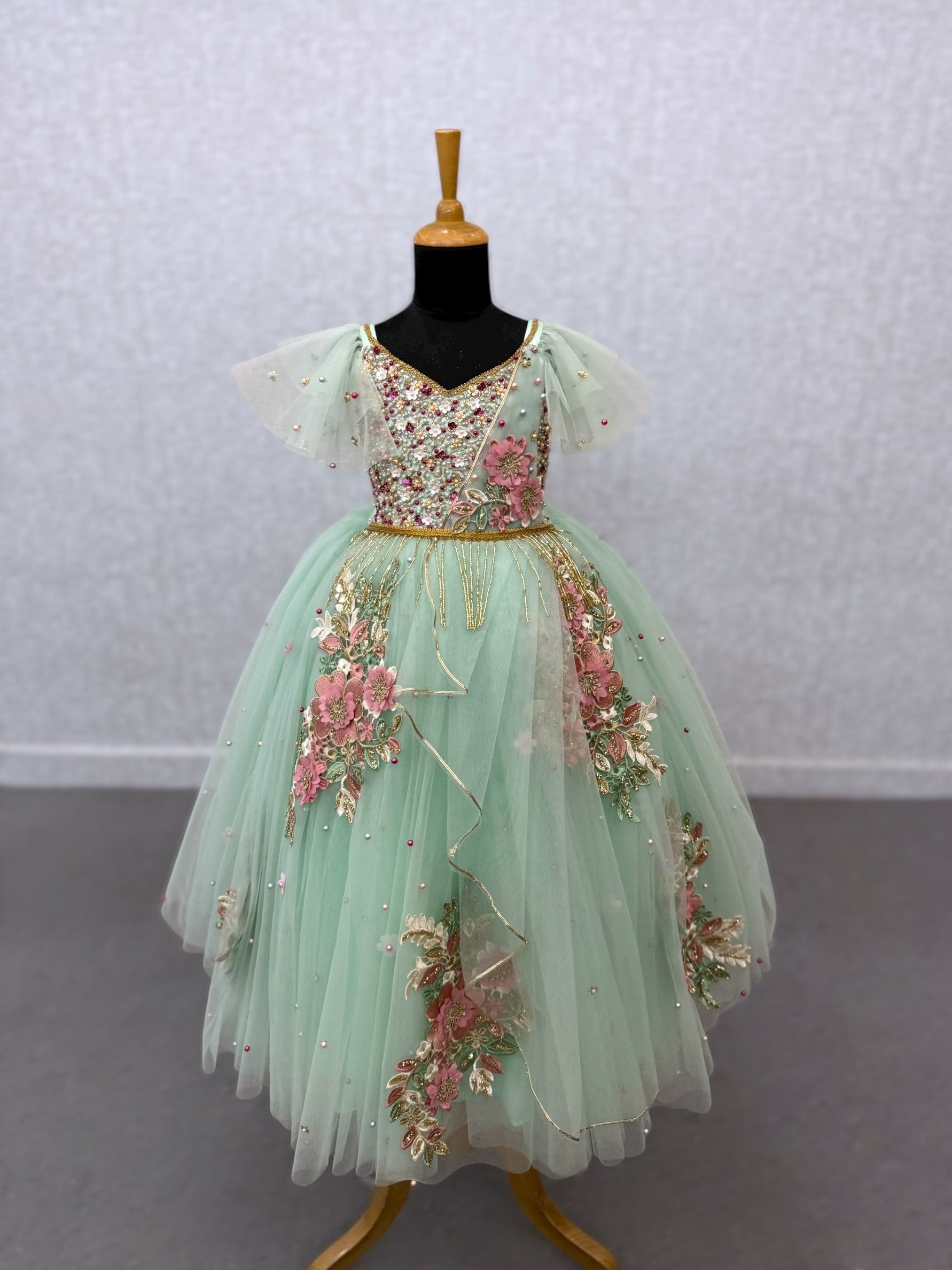 mint floral and hanging draped ball gown with intricate hand work