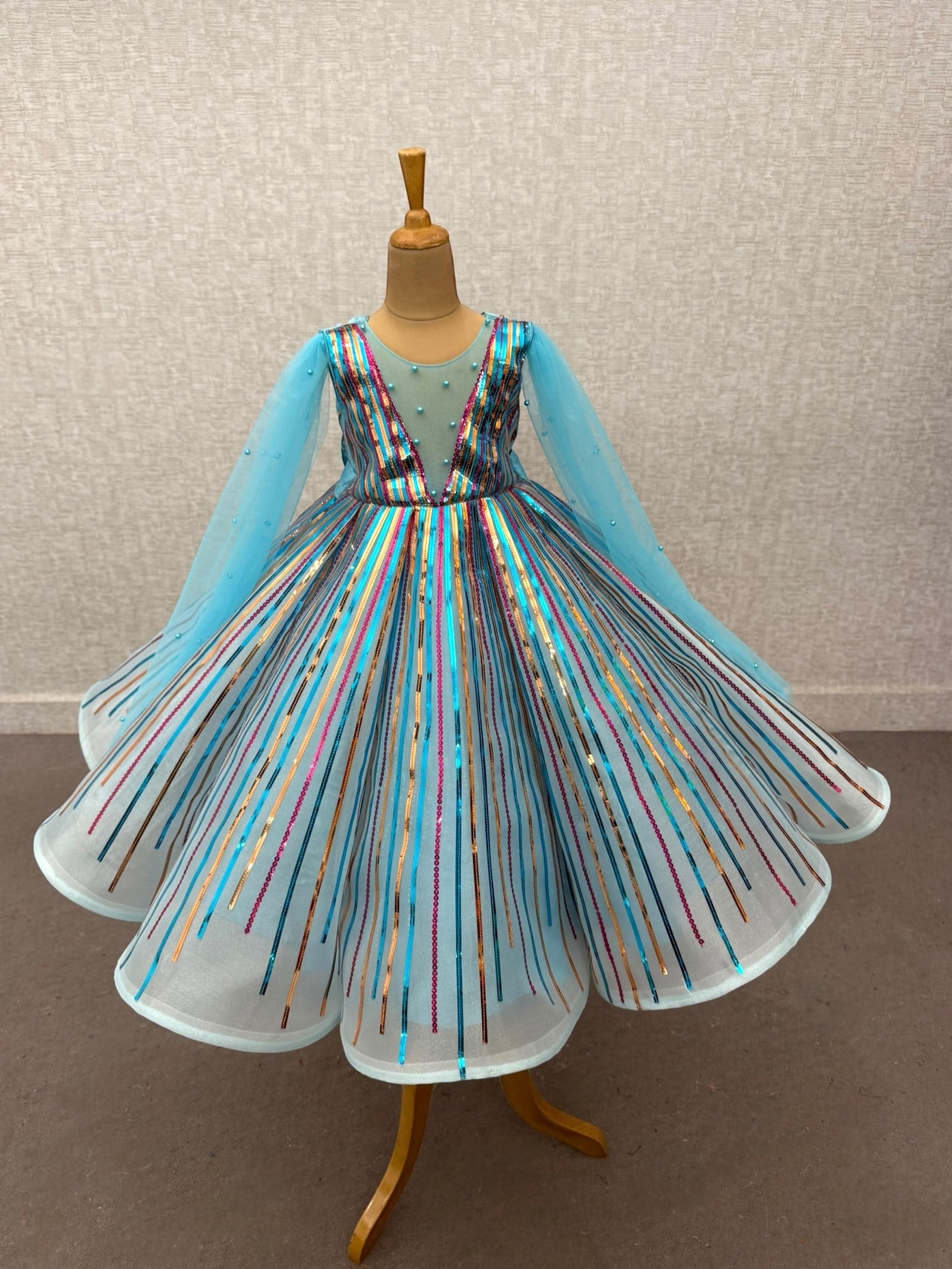 radiant blue sequenced panel gown with flowing sleeves