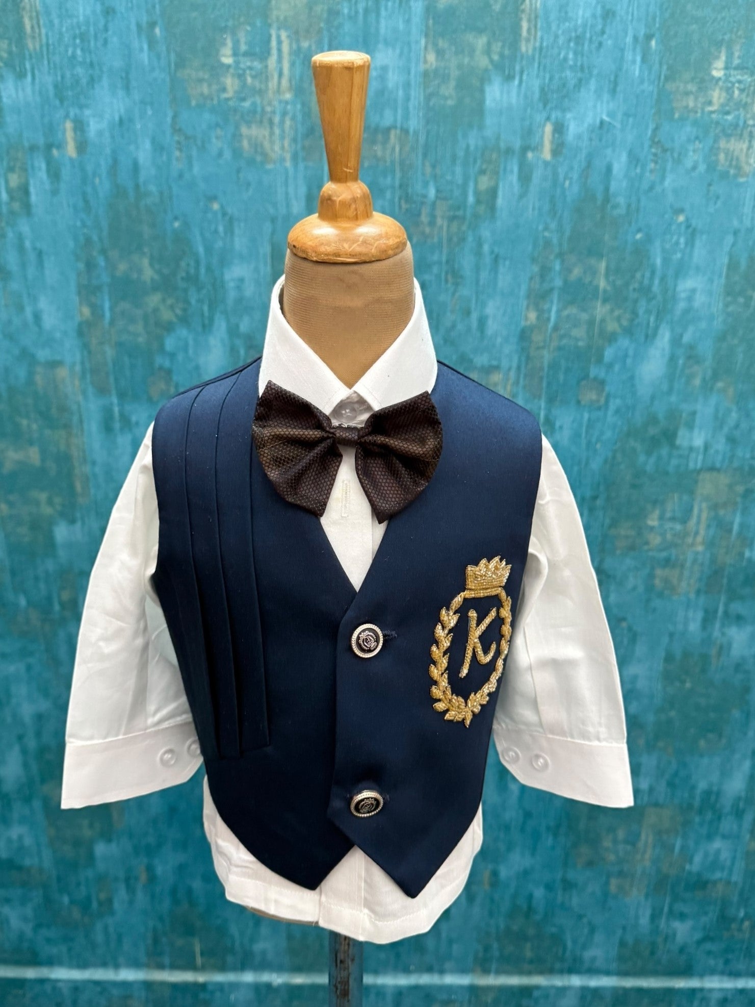 Blue waist Coat With Pleats Detailing comes with Pant, Shirt and Bow