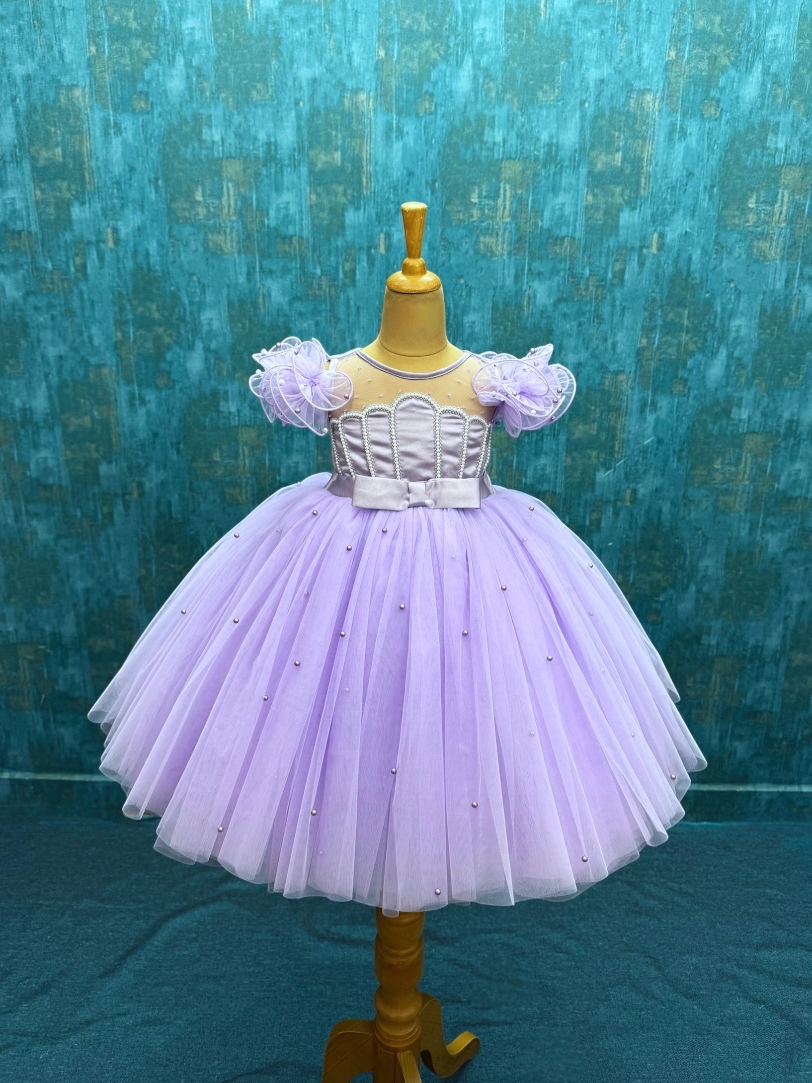 lavender tulle ball gown with shell shaped top