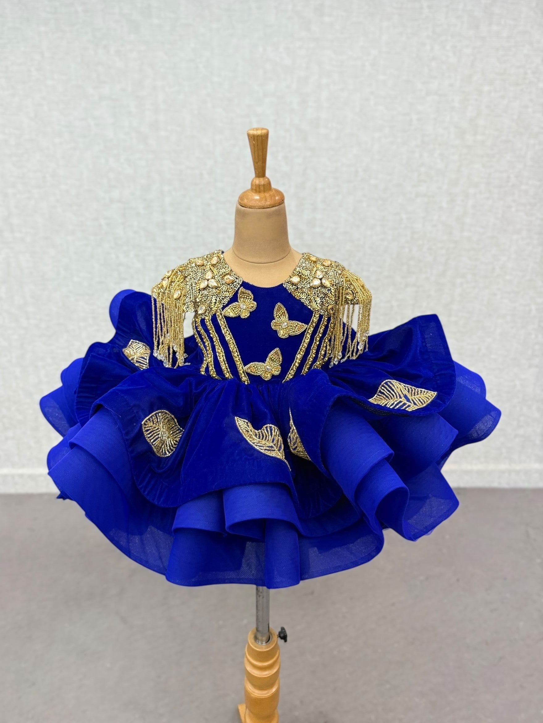 royal blue butterfly gown with gold intricate hand work