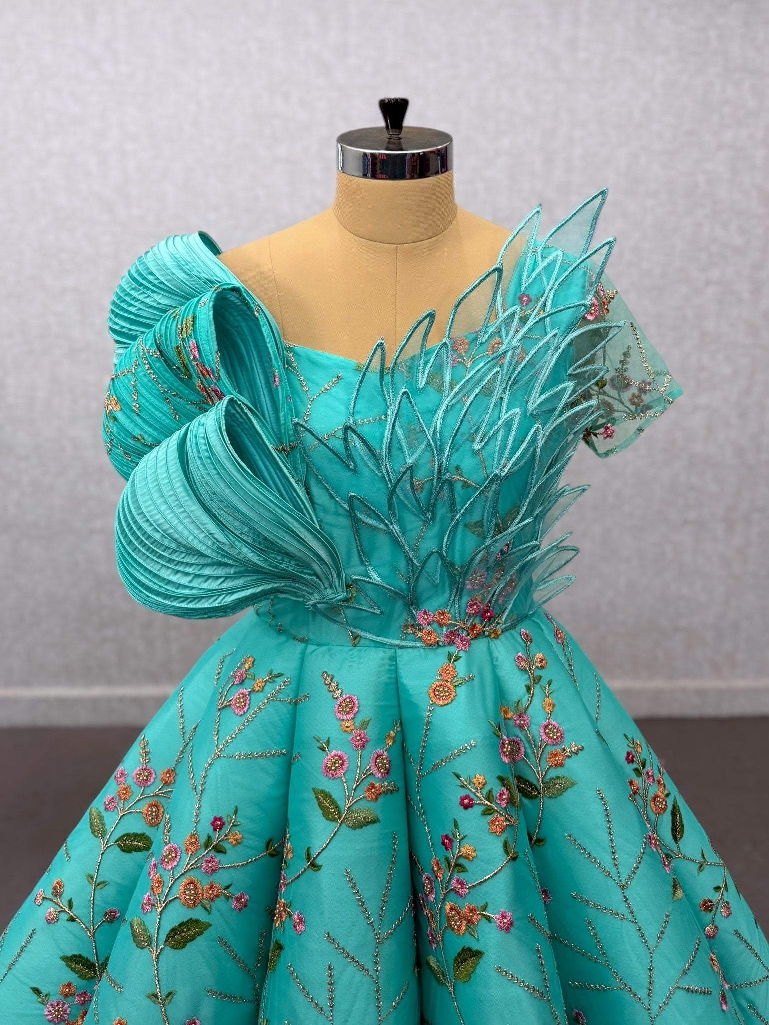 Turquoise Structured Floral Panel Ball Gown with Embossing Bows and Hand Embroidered Petals
