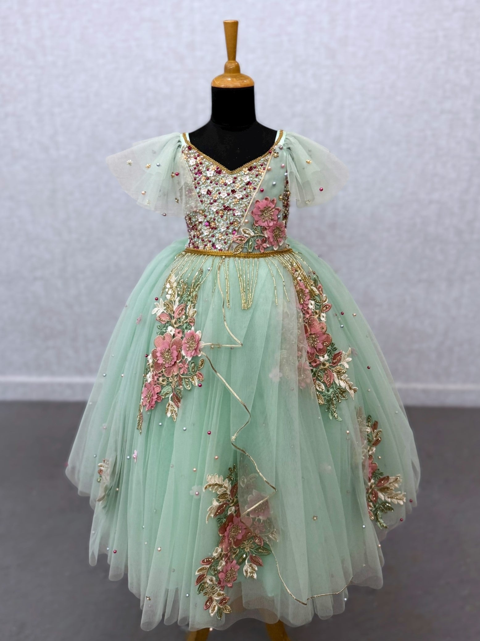 mint floral and hanging draped ball gown with intricate hand work