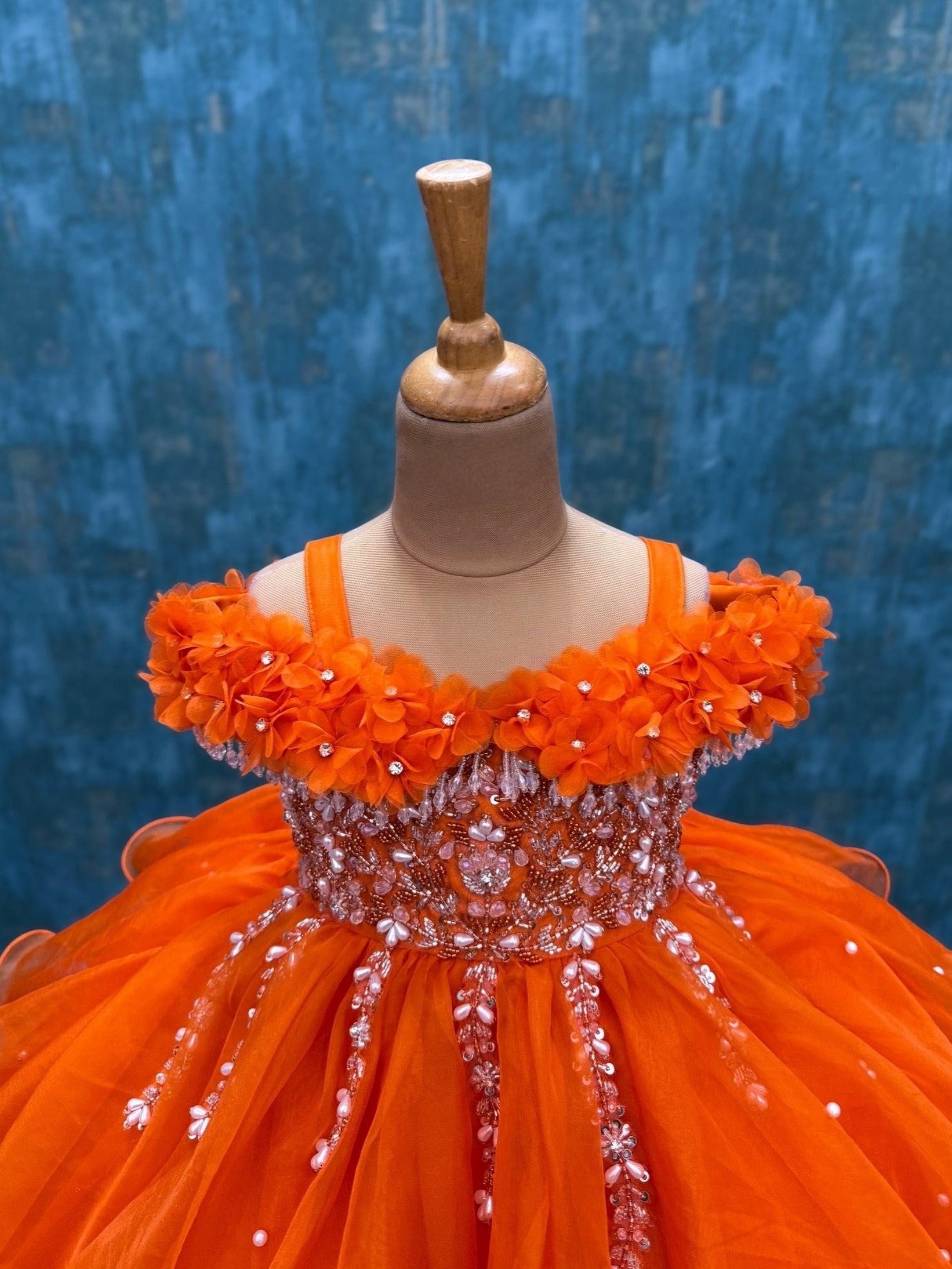 orange organza layer gown with intricate hand work