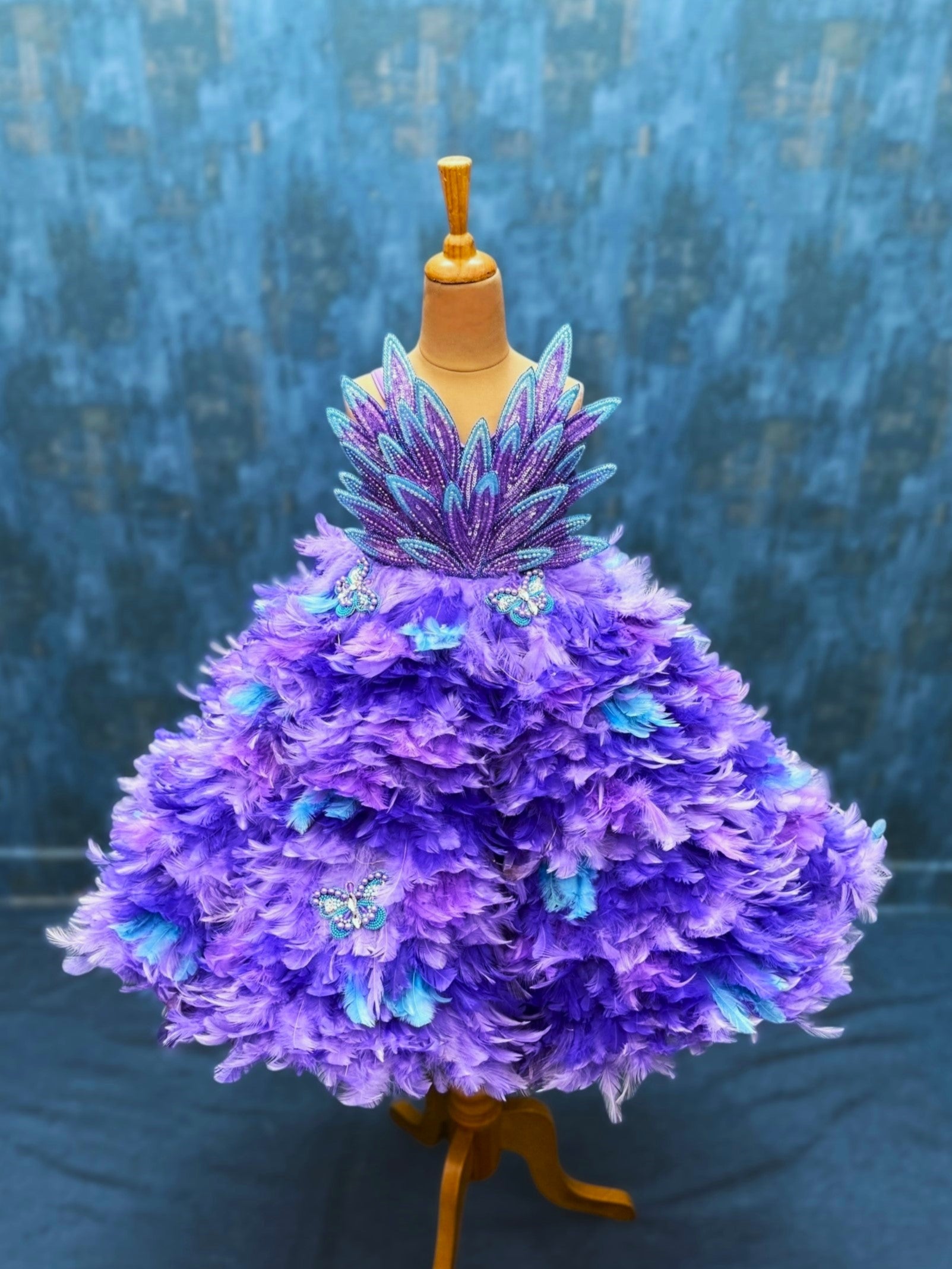 purple ombre feather panel gown with heavy petal embroidery top