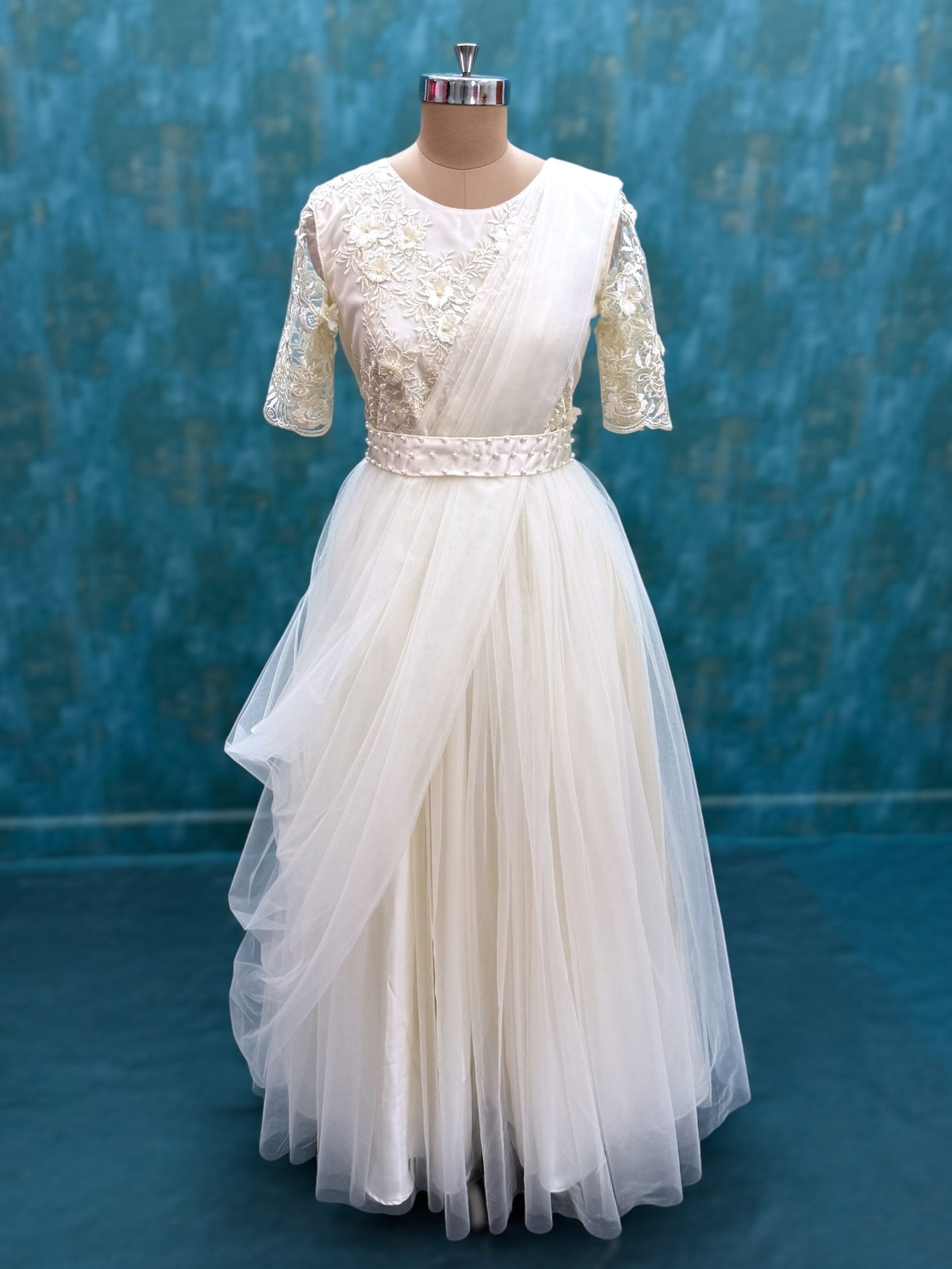 Half white floral net gown with attached dupatta and waist belt