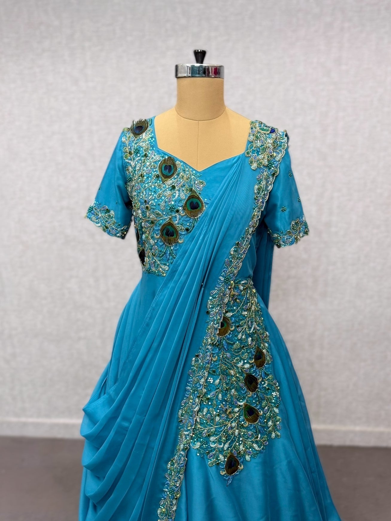 Peacock saree gown with draped dupatta and waist belt