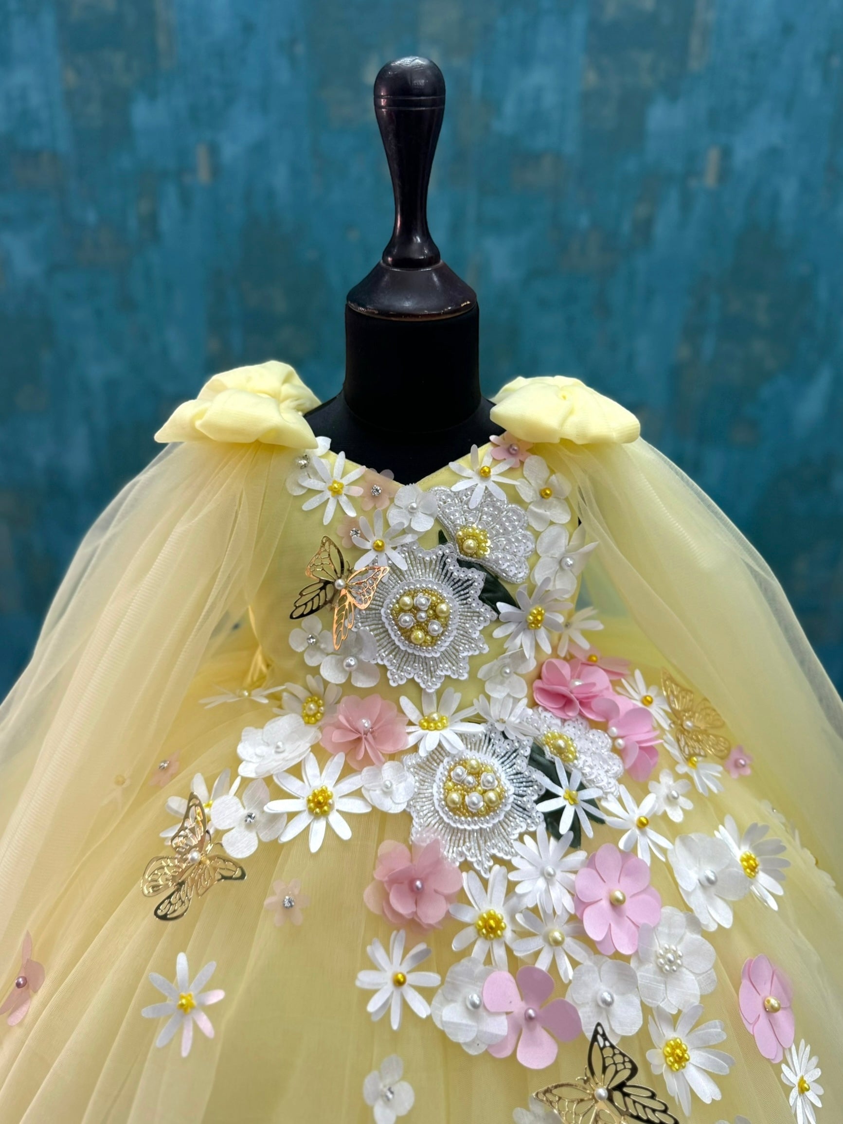 yellow and white floral and butterfly ball gown with intricate work