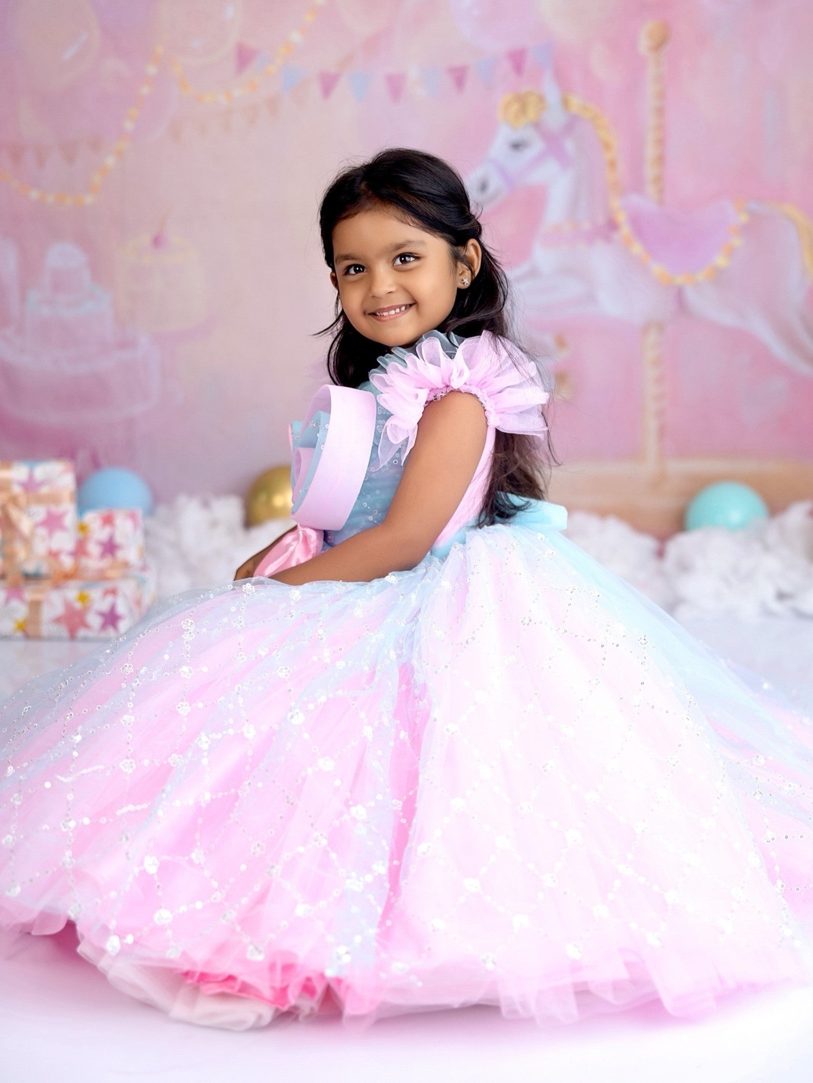 Blue and pink sequence ball gown with bow detailing