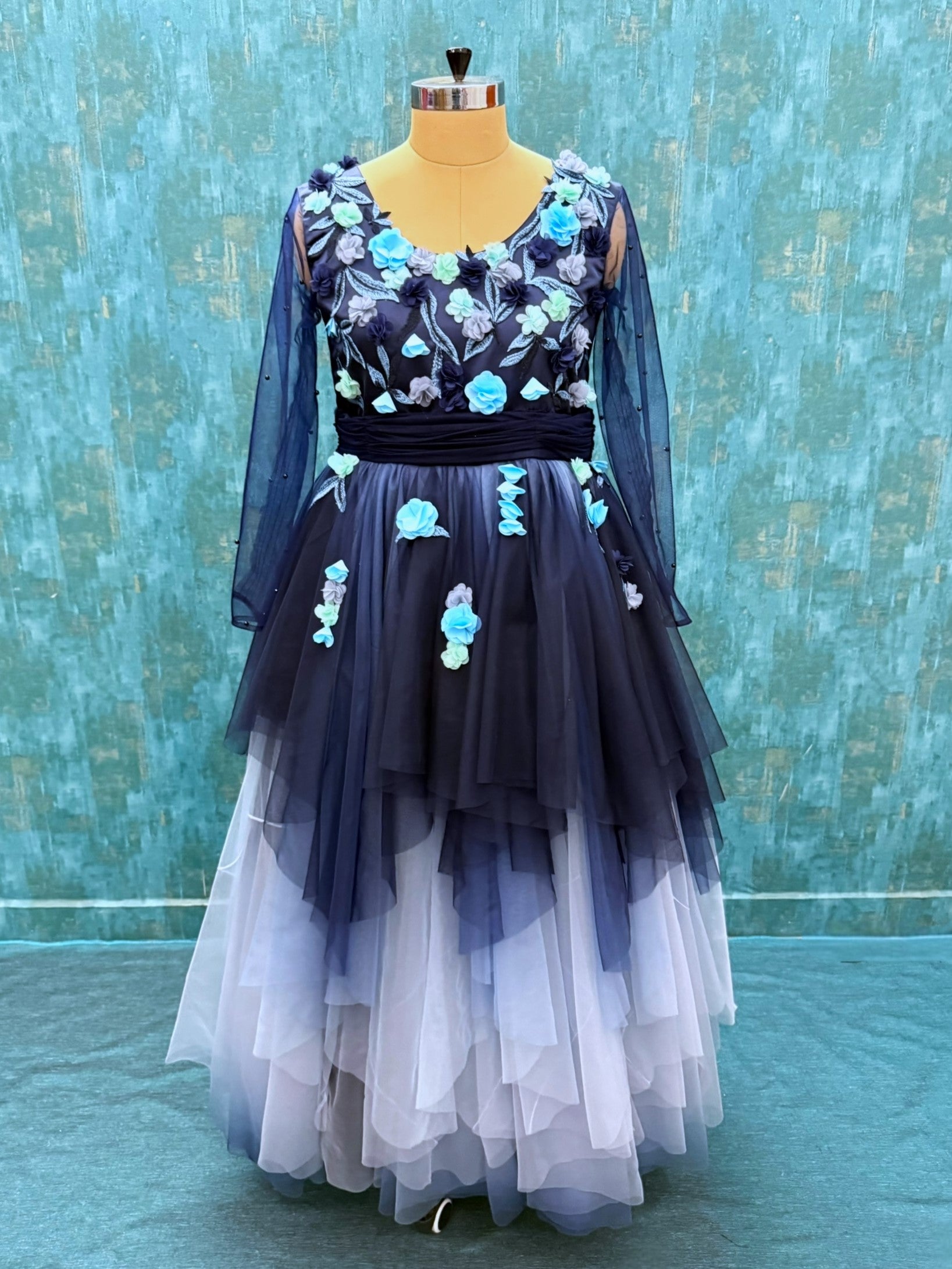BLUE OMBRE FLORAL FLOUNCE GOWN WITH NETTED SLEEVES