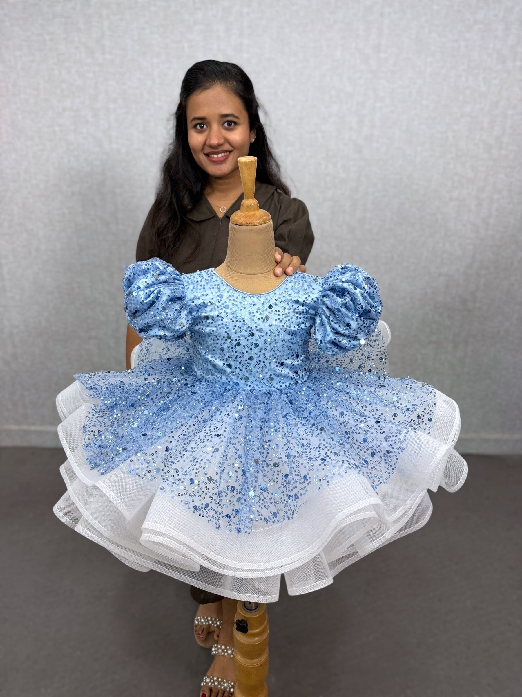 powder blue and white sequence layer gown with puff sleeves