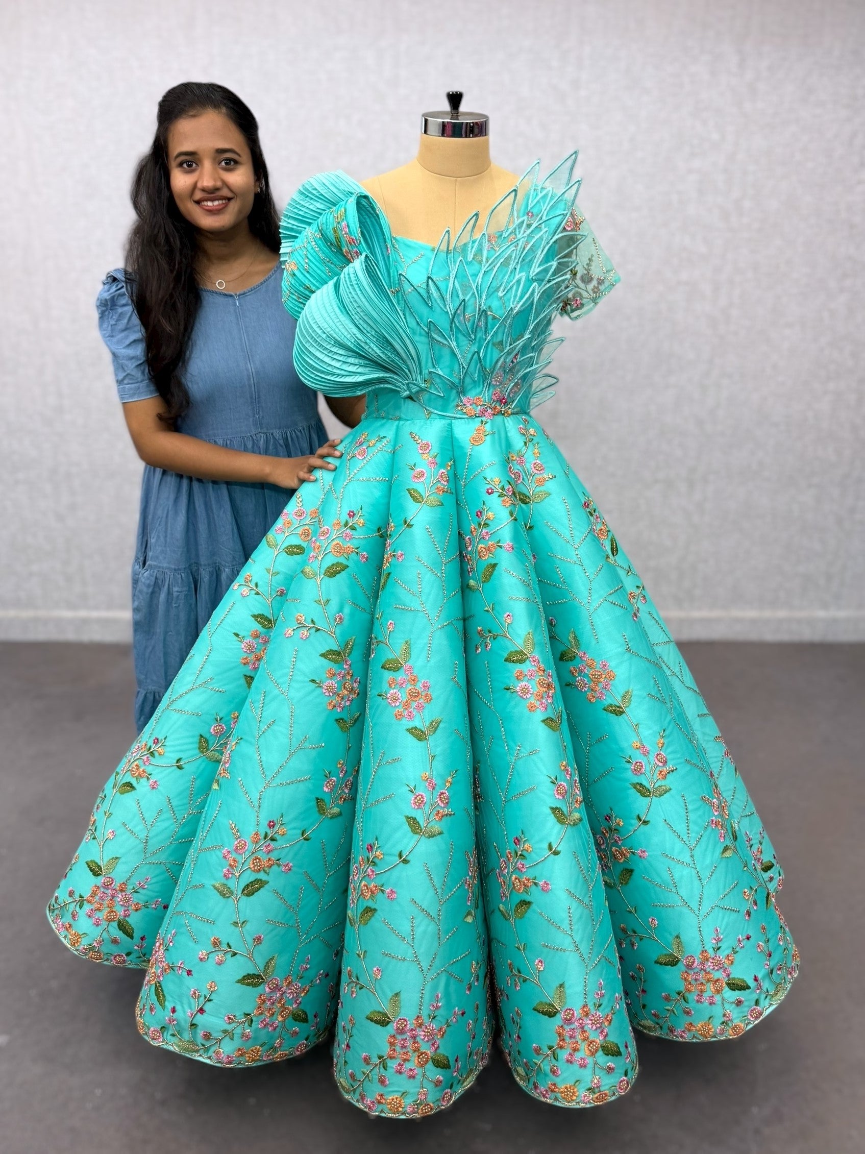 Turquoise Structured Floral Panel Ball Gown with Embossing Bows and Hand Embroidered Petals