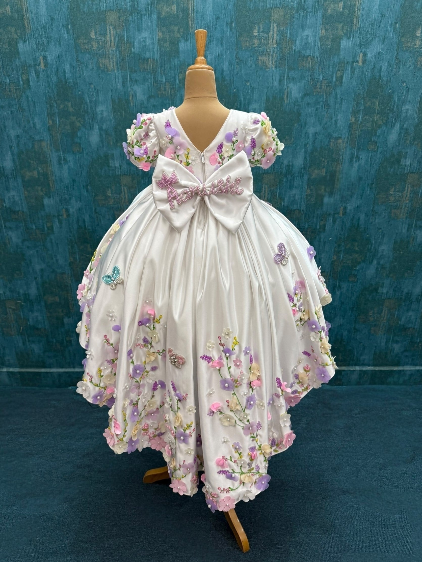 mind blowing white floral ball gown with attached trail with intricate hand work