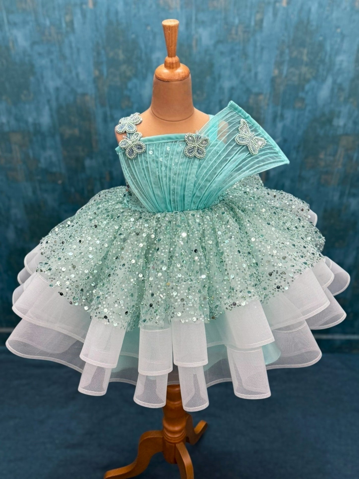 turquoise sequence layer gown with butterfly detailing