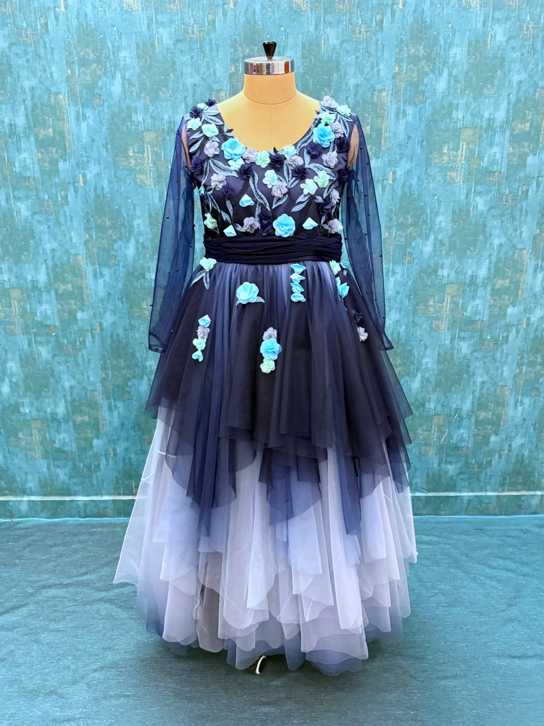 BLUE OMBRE FLORAL FLOUNCE GOWN WITH NETTED SLEEVES