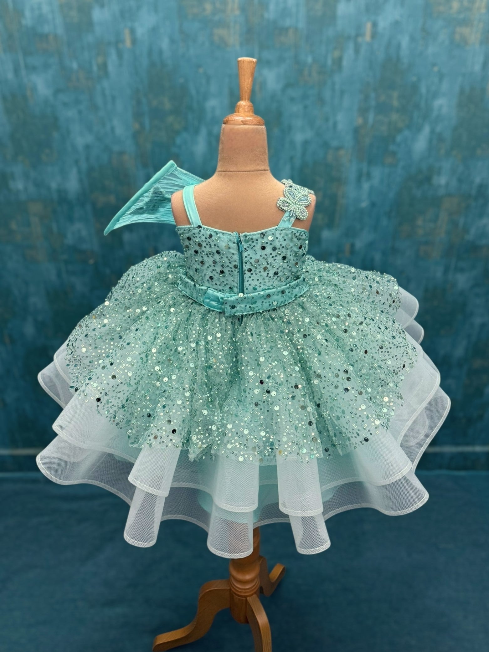 turquoise sequence layer gown with butterfly detailing