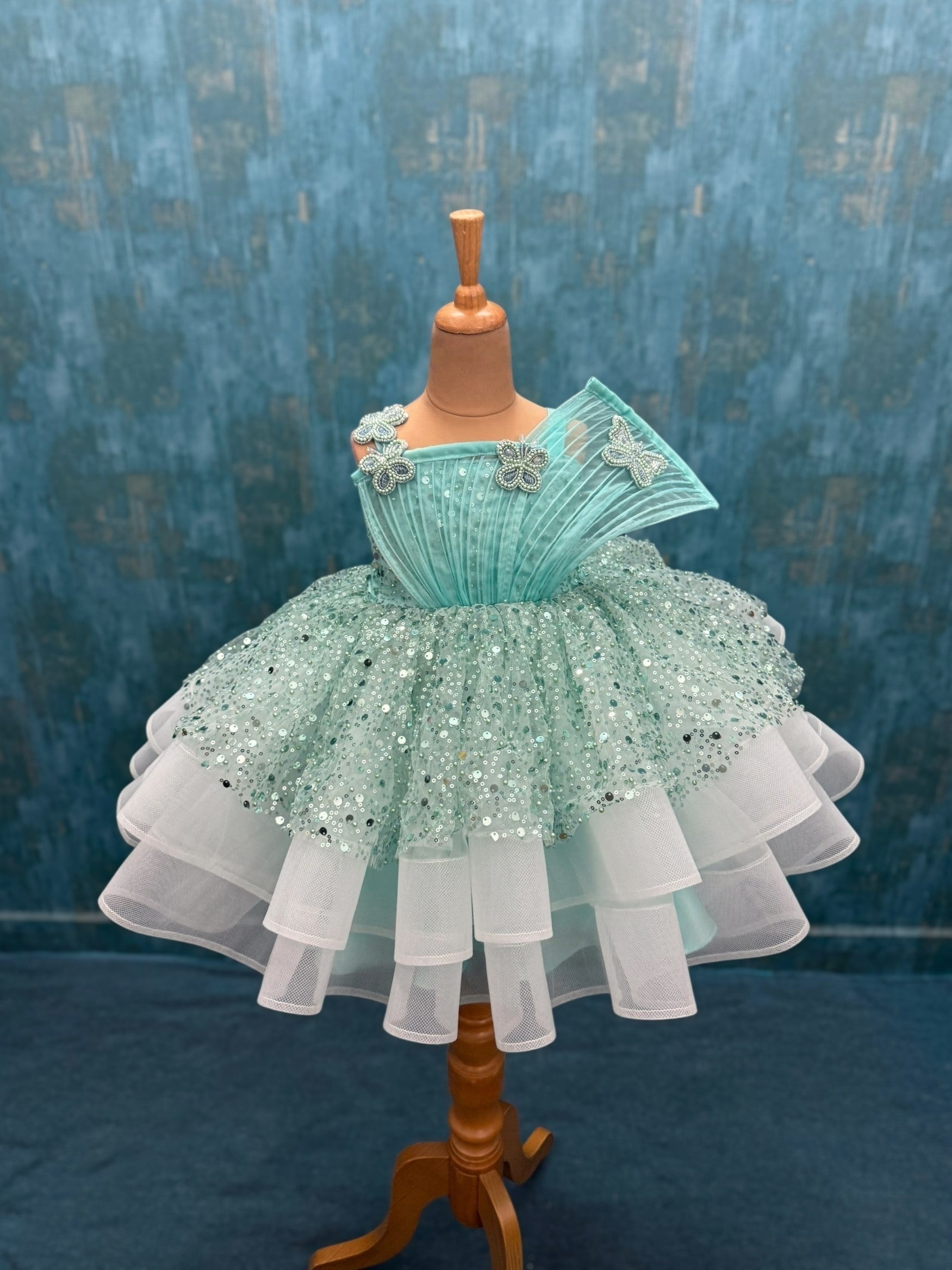 turquoise sequence layer gown with butterfly detailing