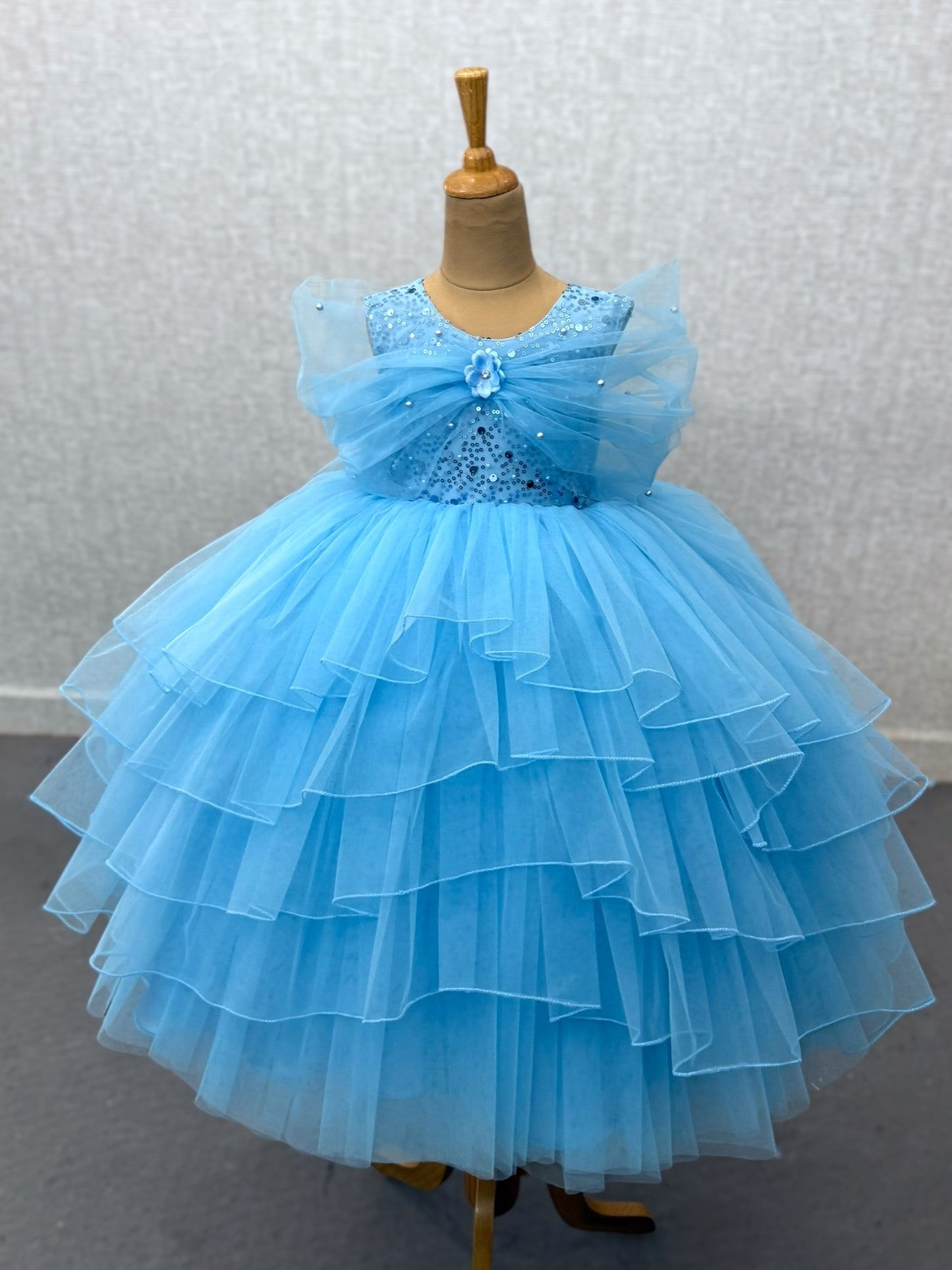 blue layer ball gown with overlapping sleeves