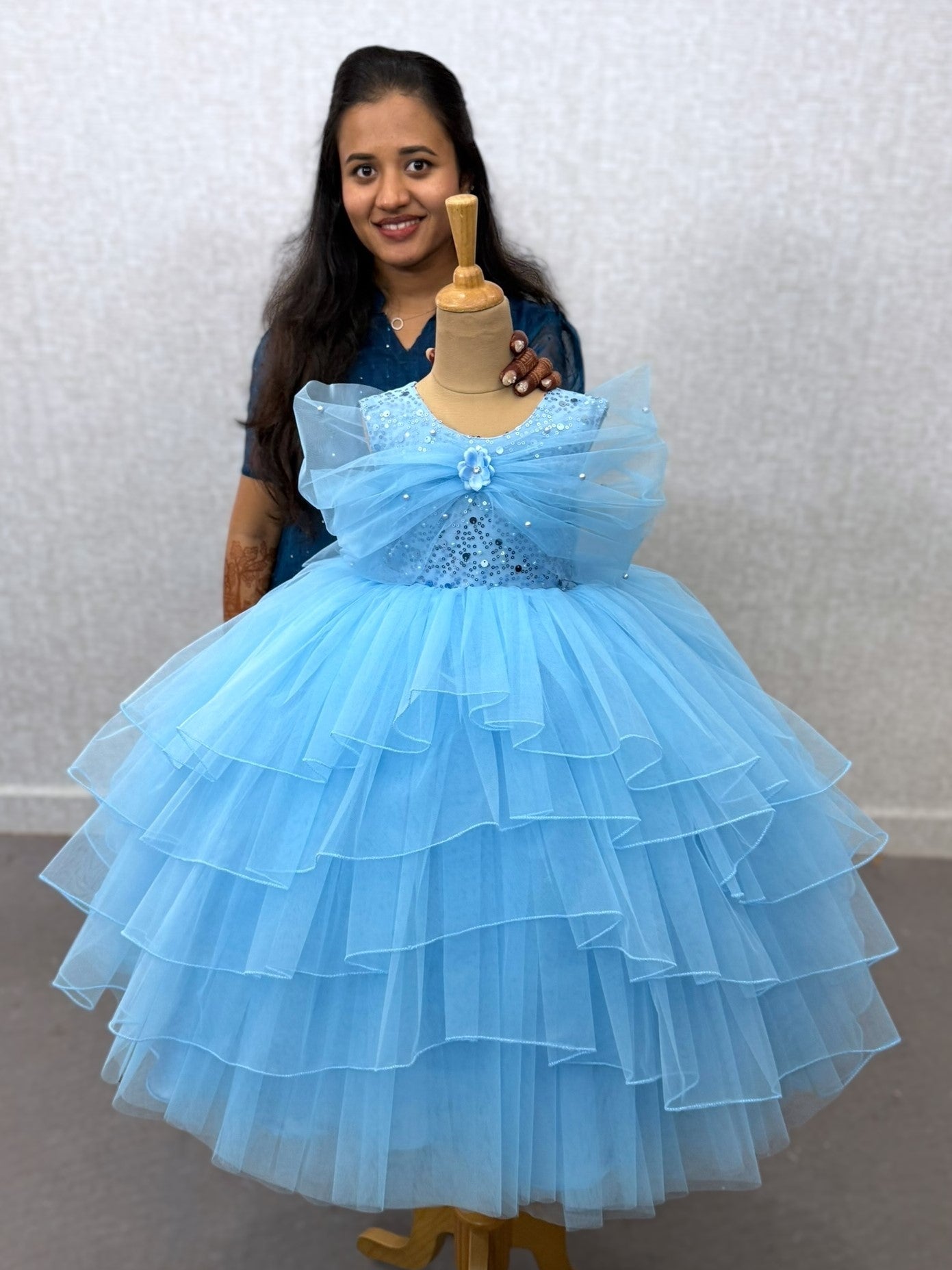 blue layer ball gown with overlapping sleeves