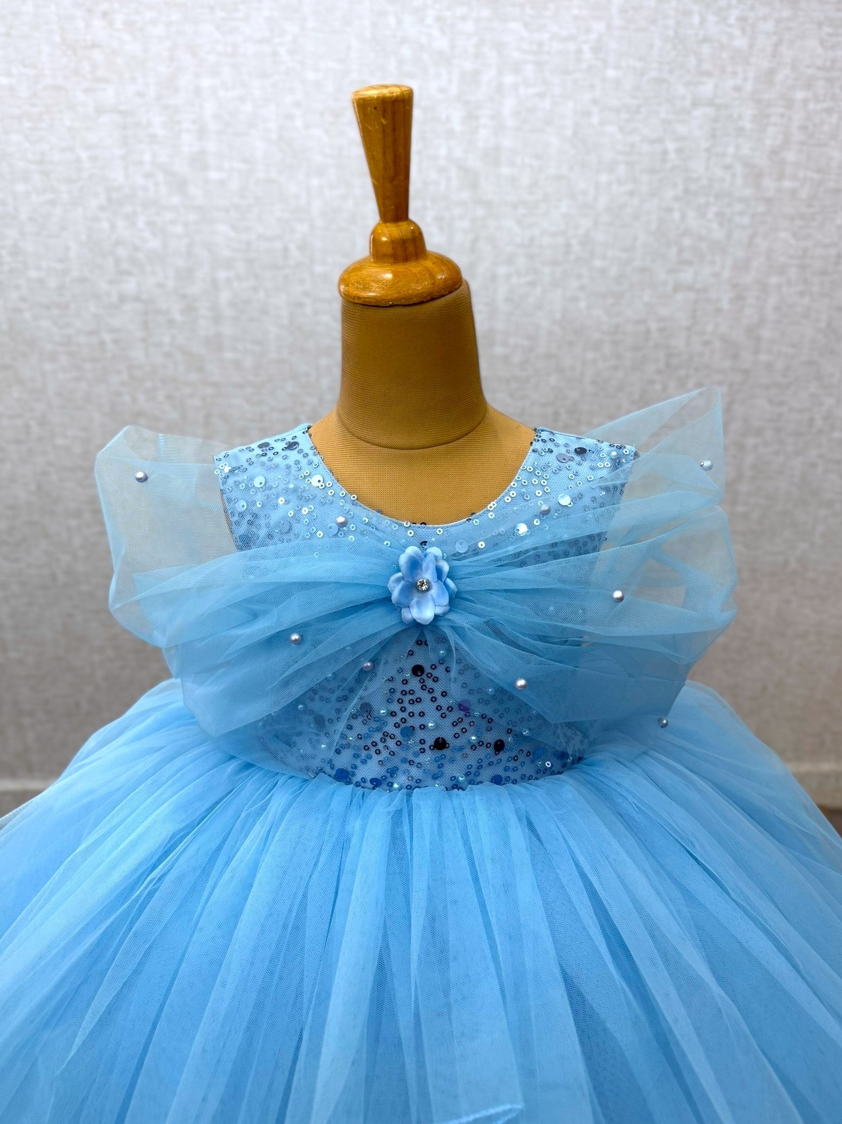 blue layer ball gown with overlapping sleeves