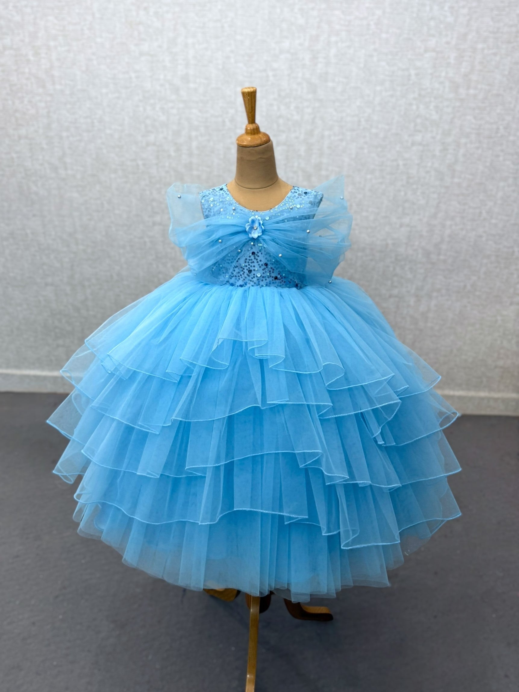 blue layer ball gown with overlapping sleeves