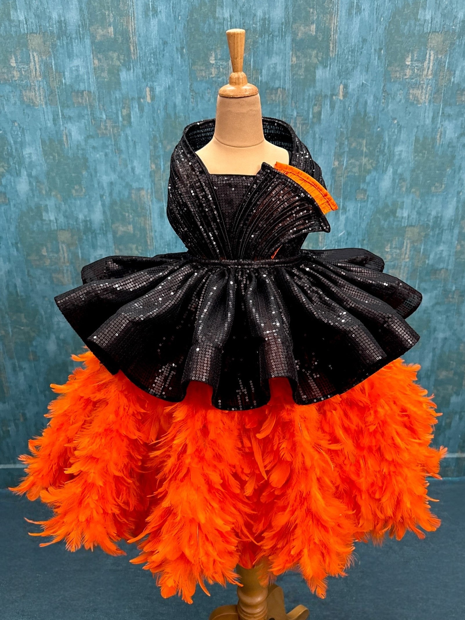 Orange feather structure ball with detachable black sequin skirt