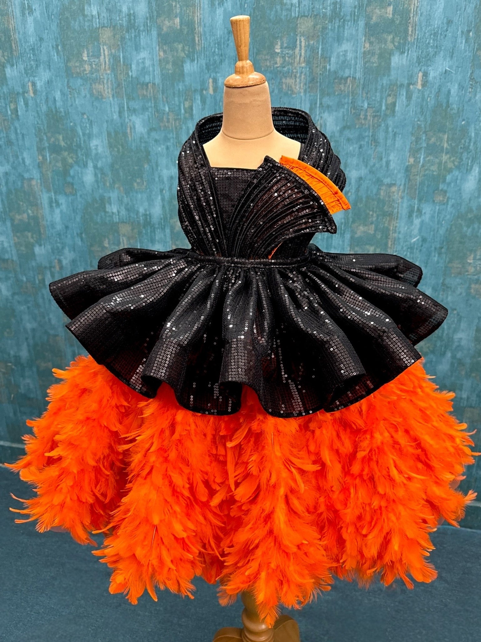 Orange feather structure ball with detachable black sequin skirt