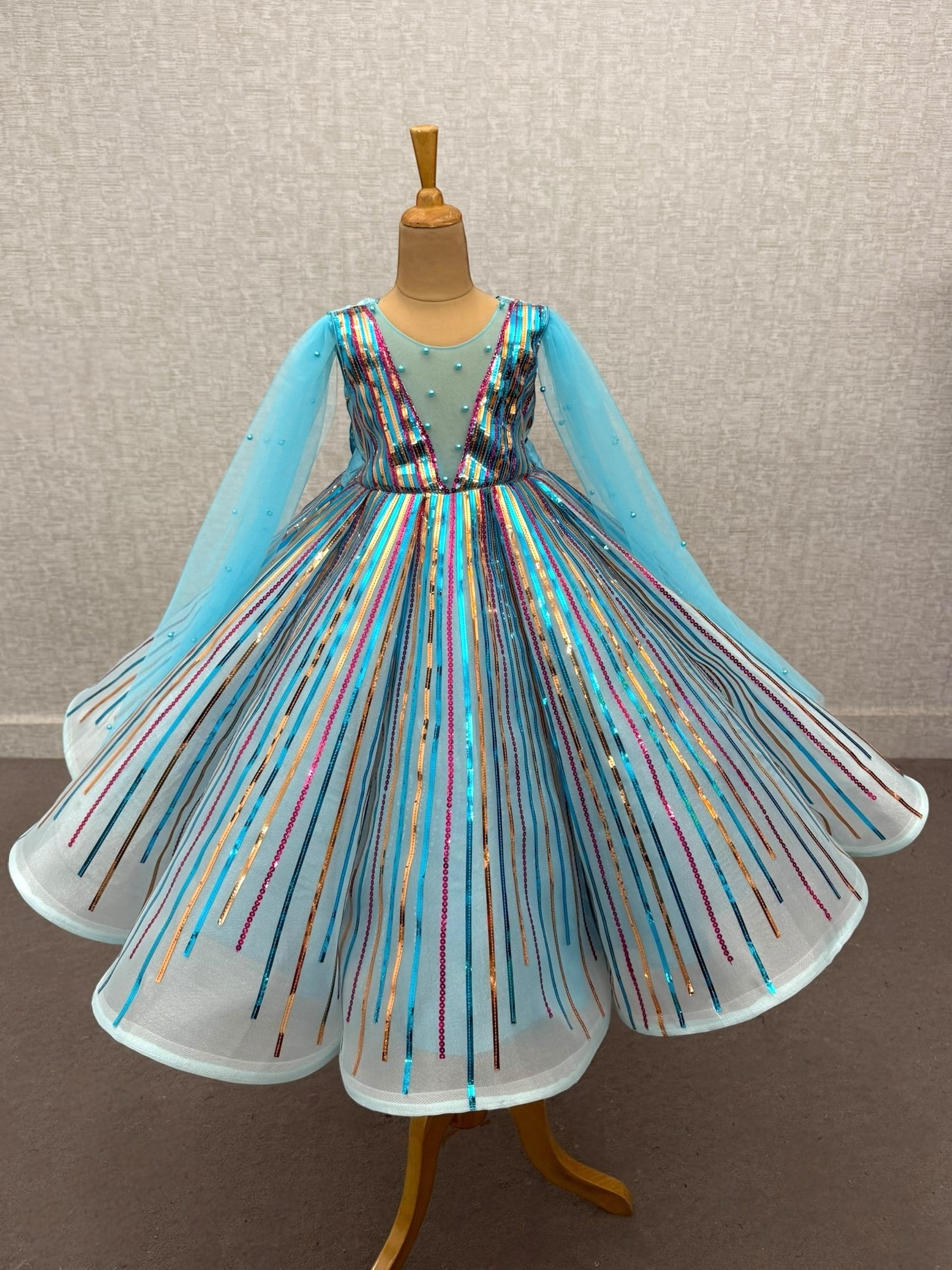 radiant blue sequenced panel gown with flowing sleeves