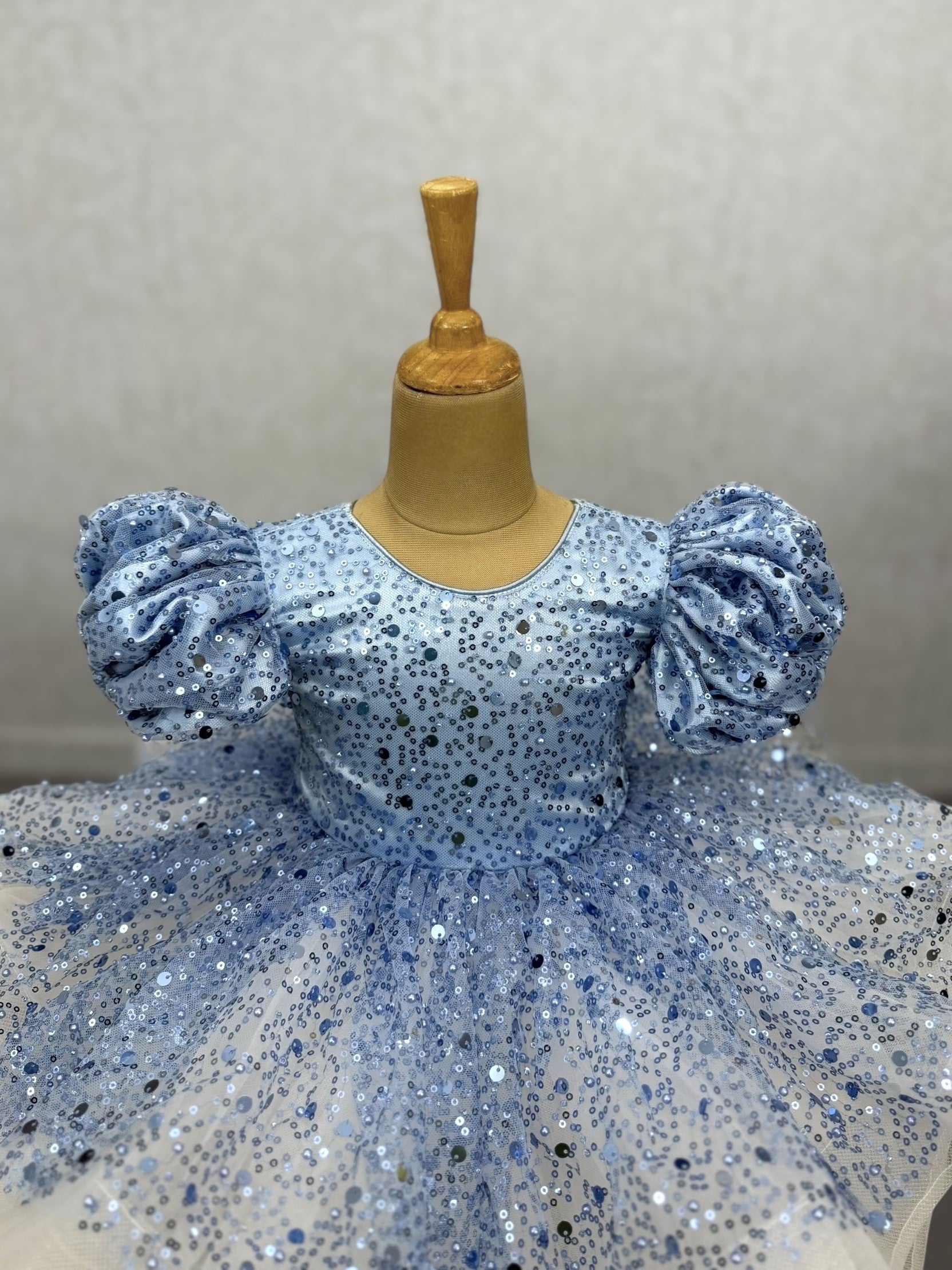 powder blue and white sequence layer gown with puff sleeves