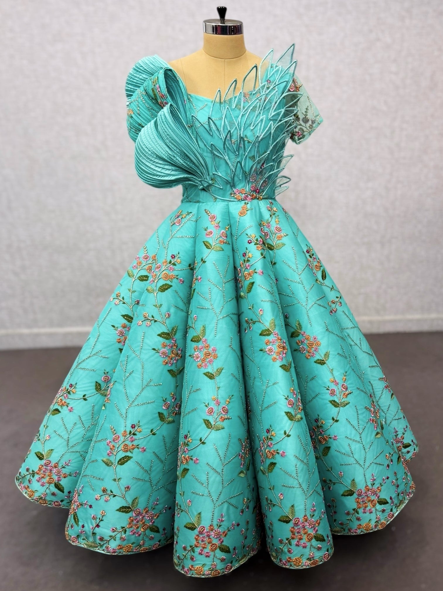 Turquoise Structured Floral Panel Ball Gown with Embossing Bows and Hand Embroidered Petals