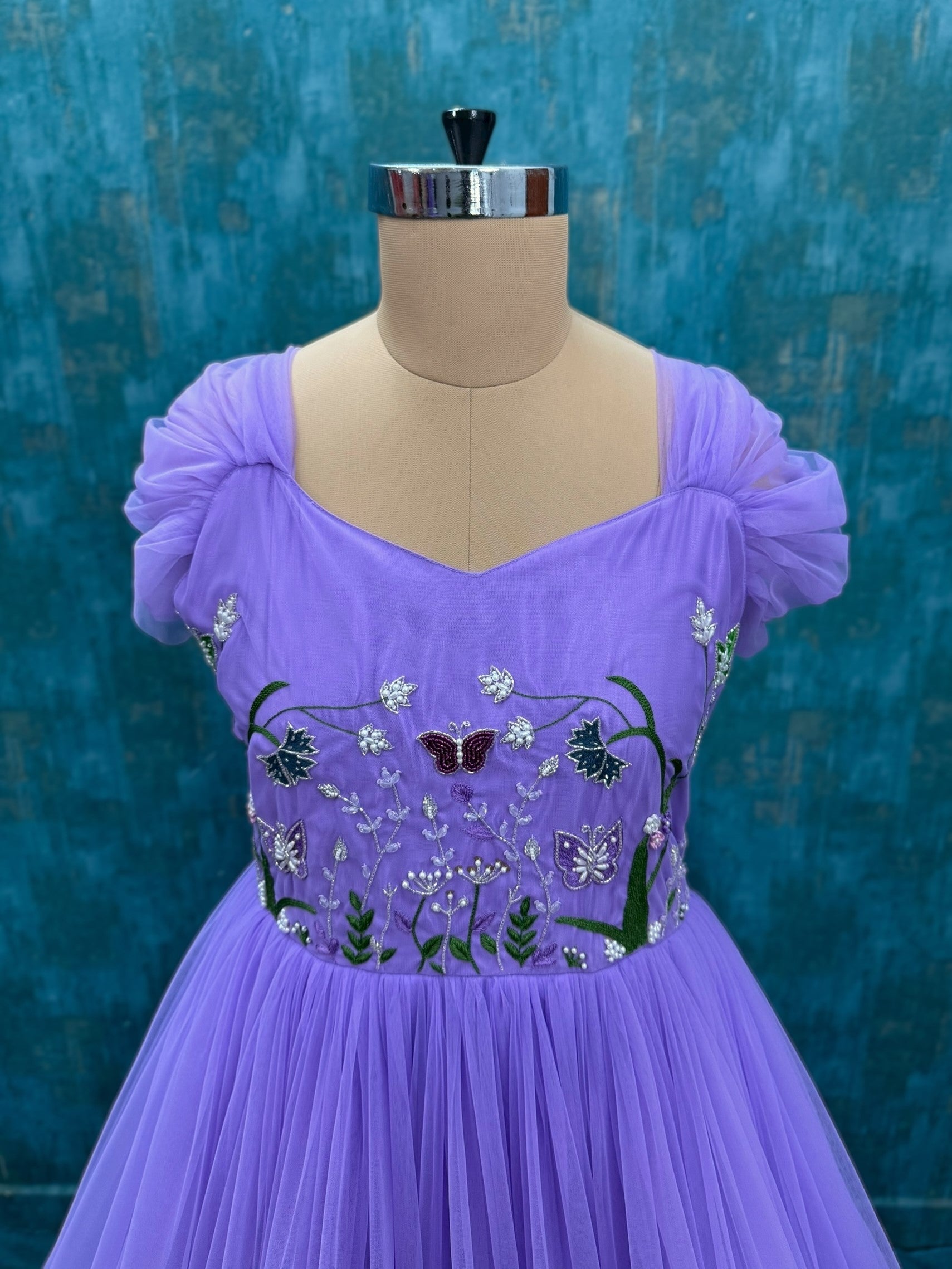 Floral and butterfly hand embroidered ruffle gown