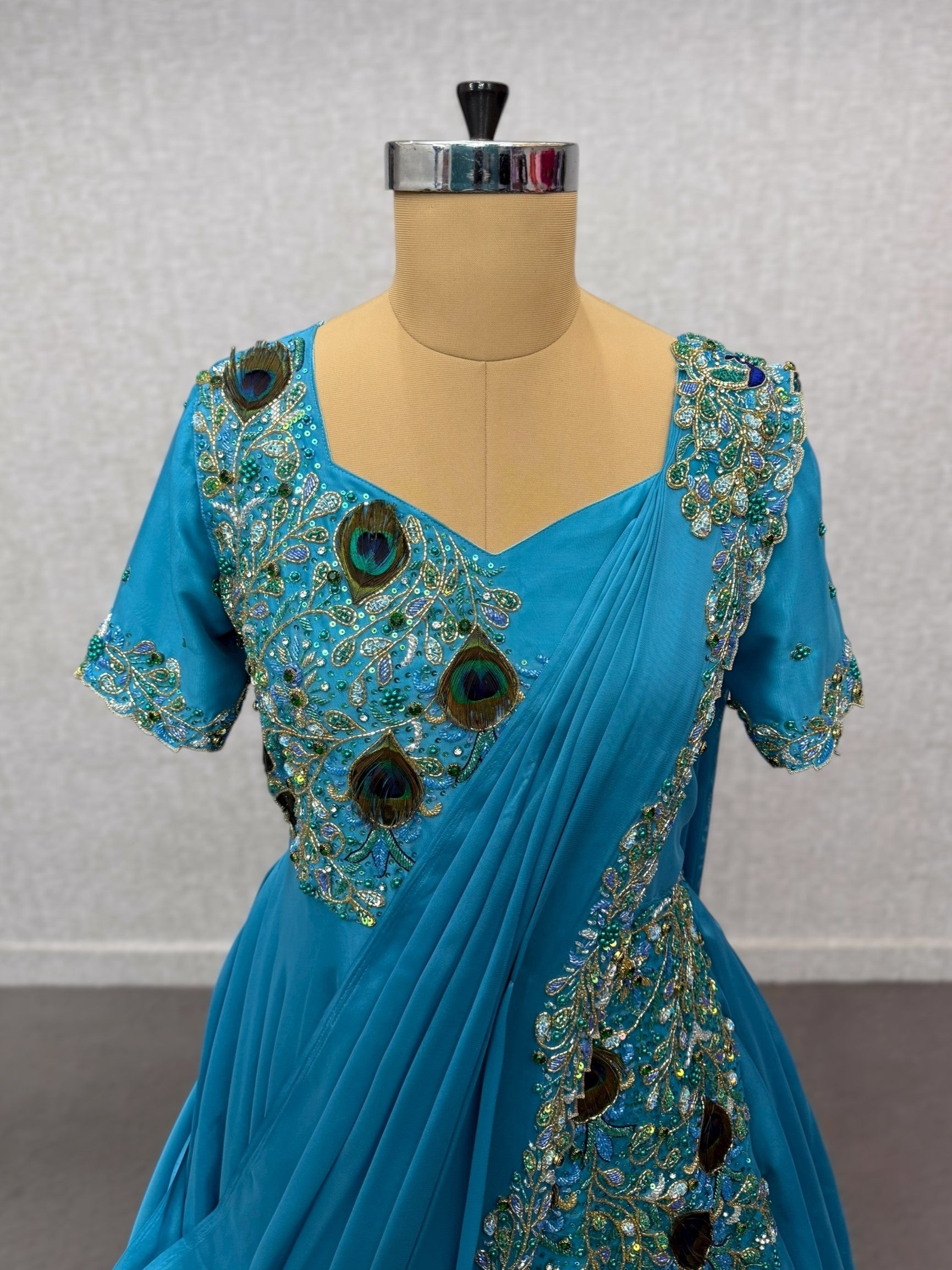 Peacock saree gown with draped dupatta and waist belt