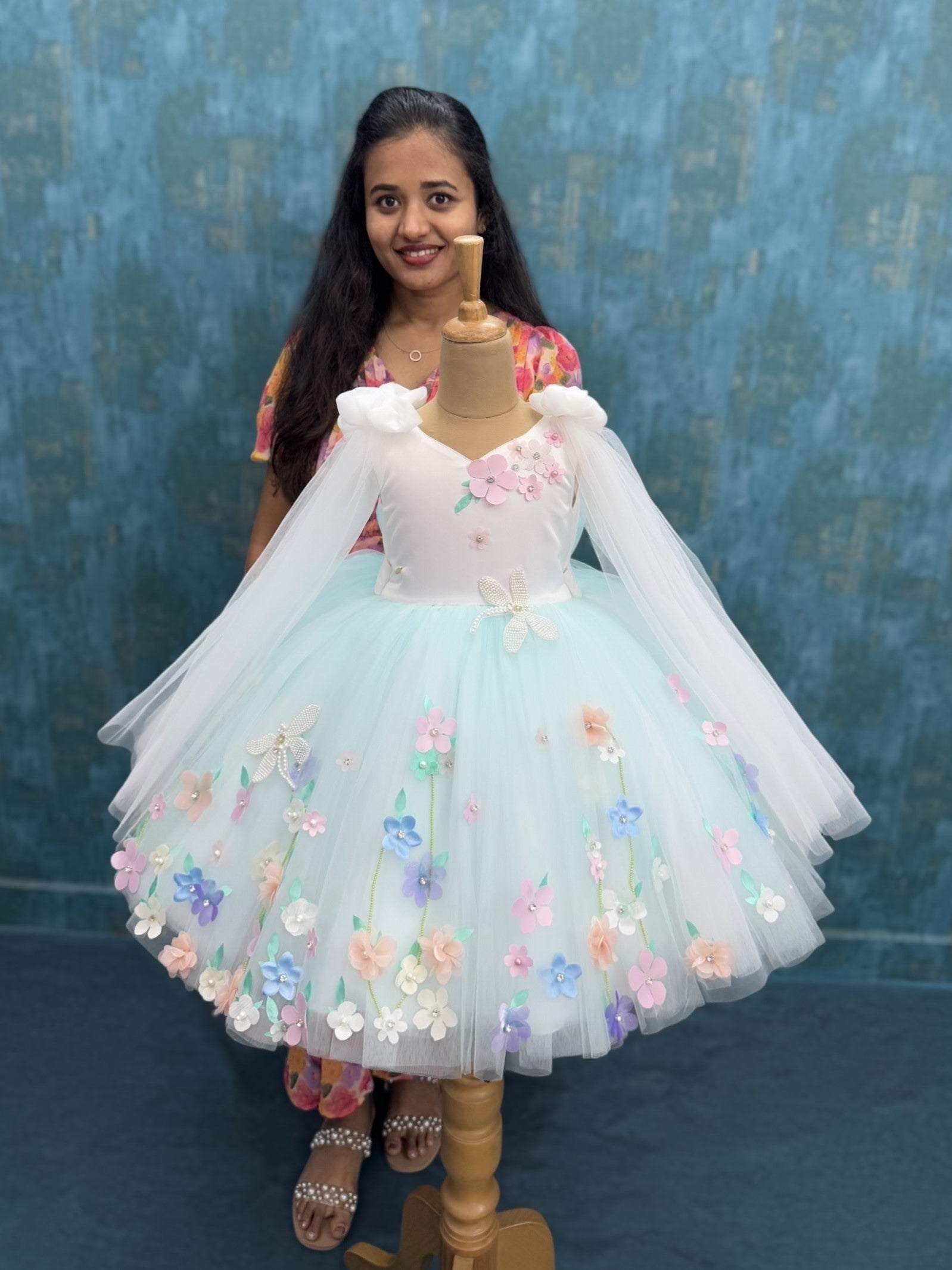 White and blue floral ball gown with bow shoulders