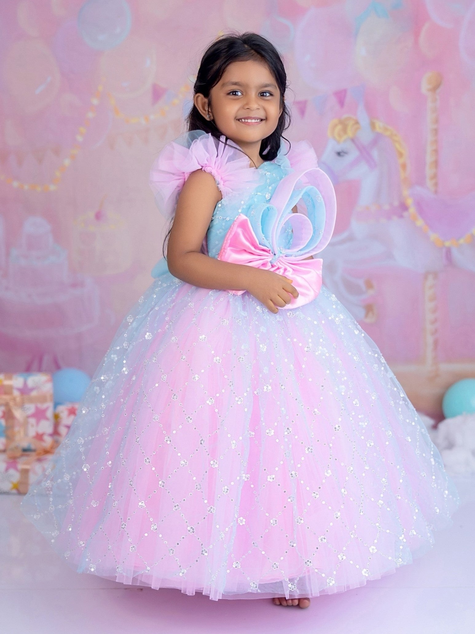 Blue and pink sequence ball gown with bow detailing