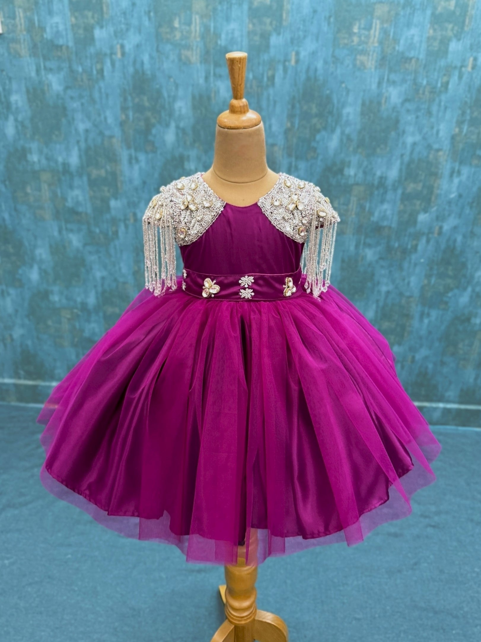 dreamy magenta gown with crystal hanging sleeves and waist belt