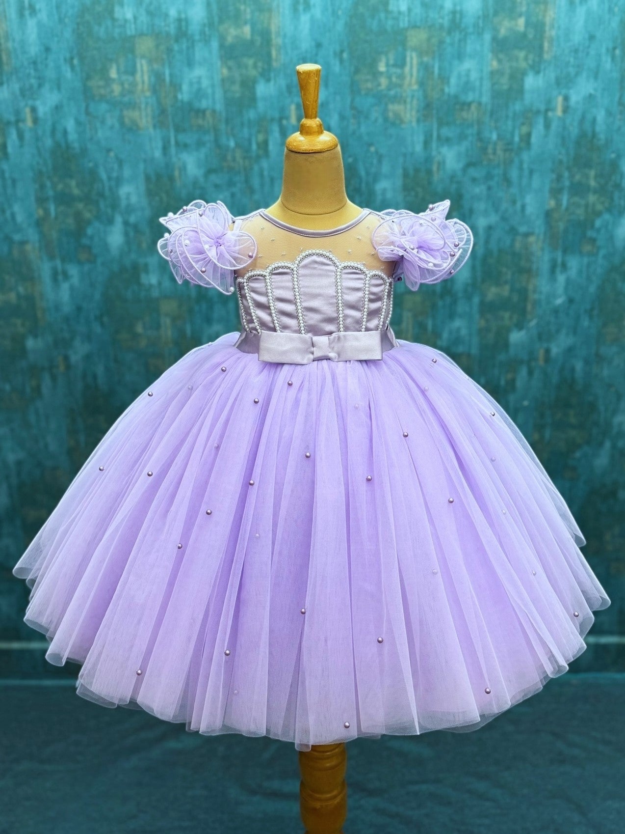 lavender tulle ball gown with shell shaped top