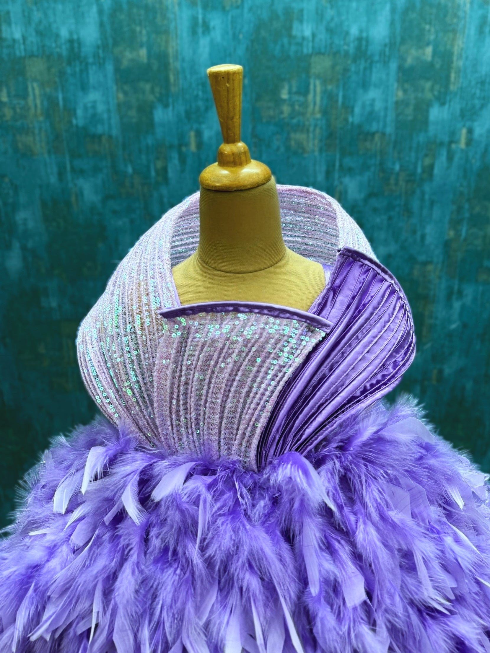lavender and purple feather ball gown with sequenced structure top