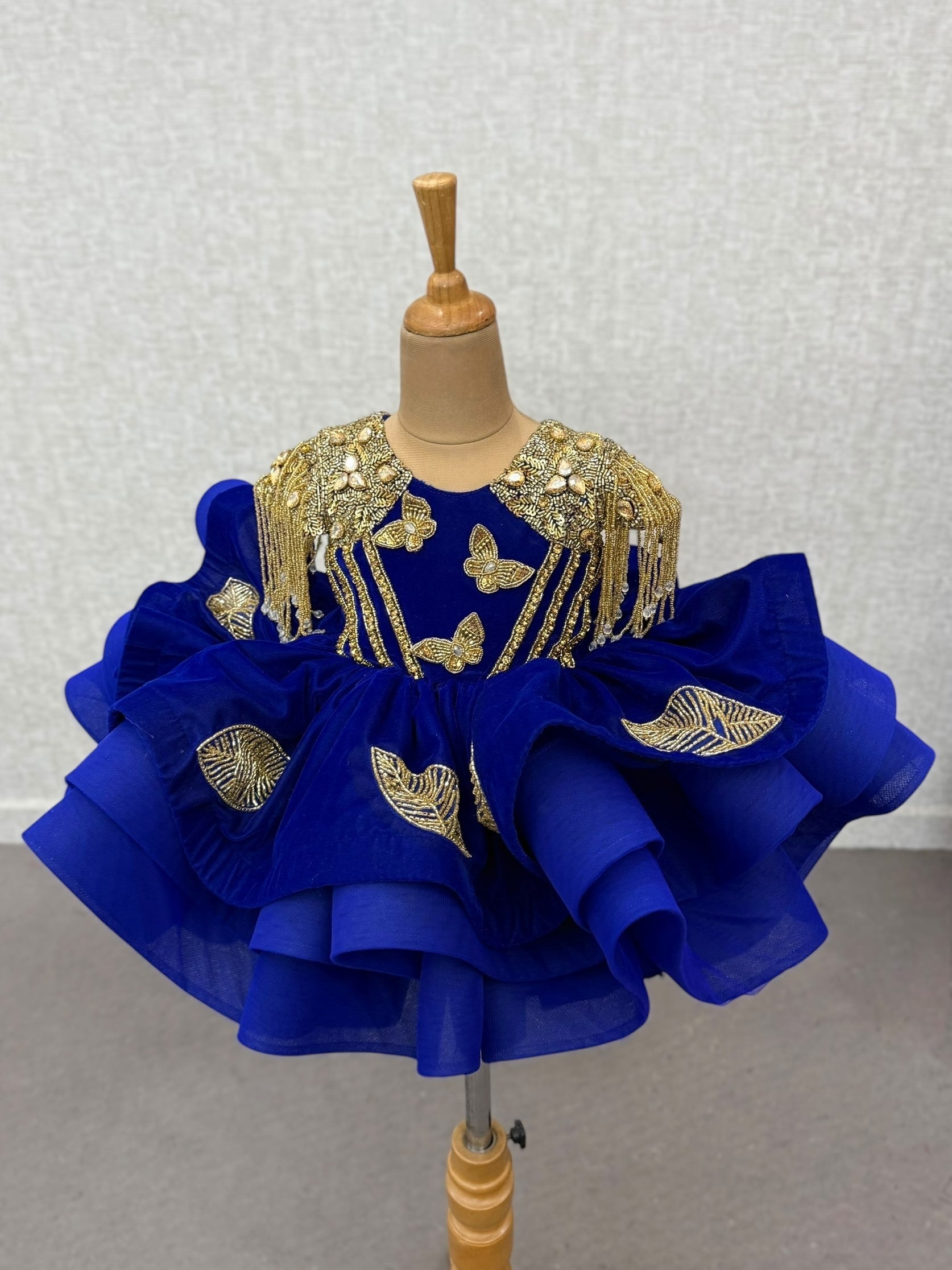 royal blue butterfly gown with gold intricate hand work